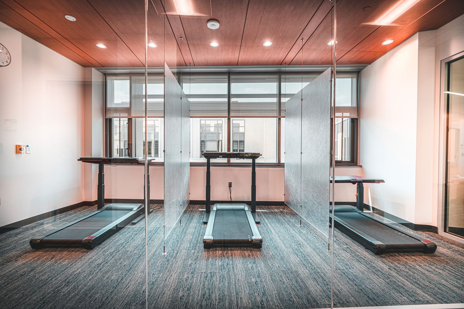 Interior view of treadmill workstations at Duke University Interprofessional Education Center.
