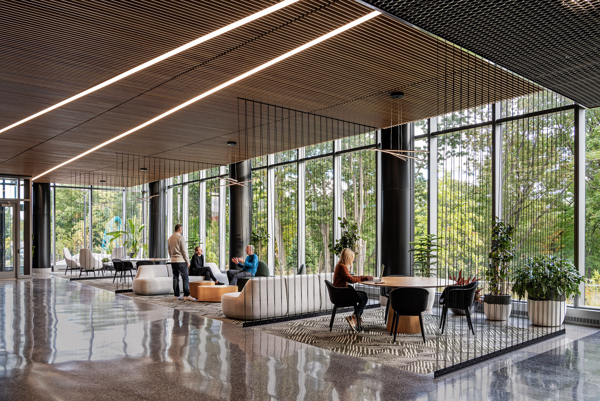 The lobby of 100 Forge features comfortable seating with natural views.