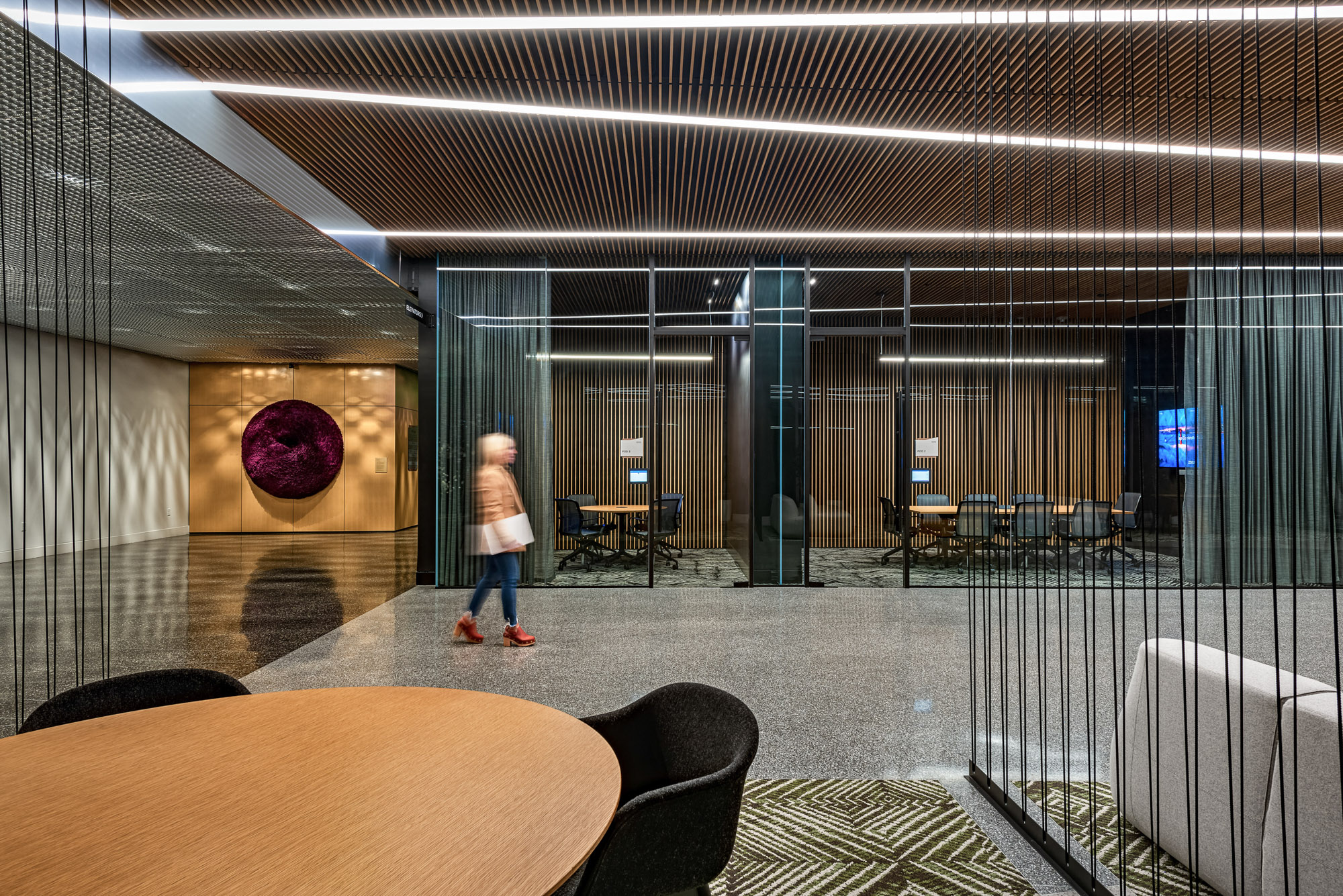 The 100 Forge lobby contains numerous working pods and conference rooms.