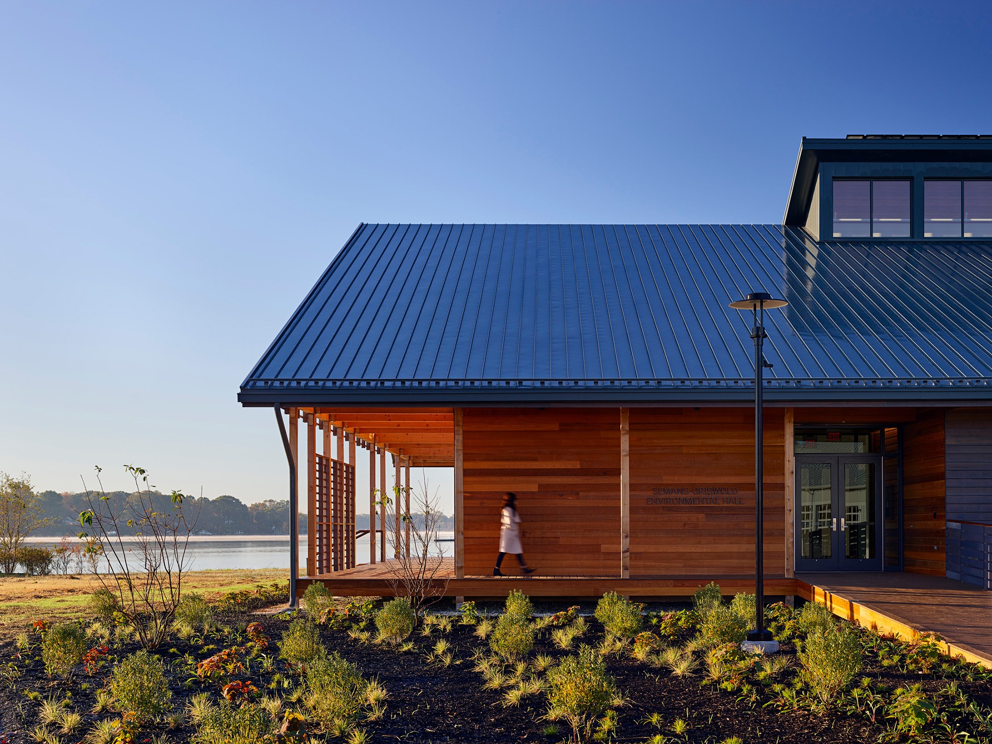 Wood and metal complement the simple form and preserve the local waterfront vernacular.
