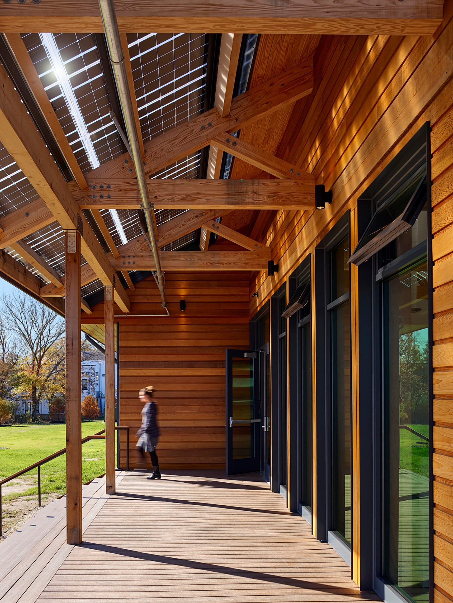 Heavy timber trusses, cedar siding, and maple window trim showcase craftsmanship within each material...