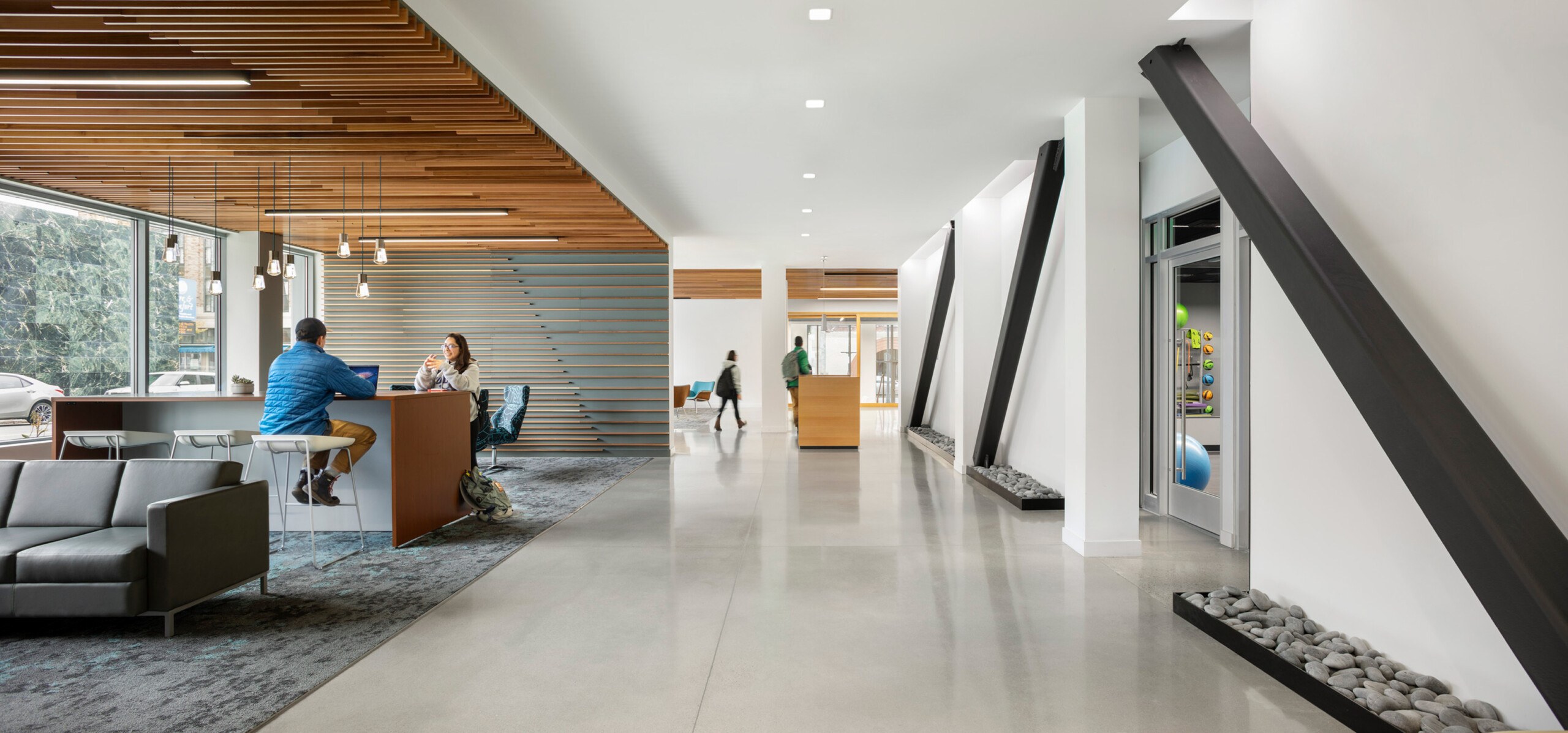 Exposed structural steel bracing in Alfond Commons at Colby College