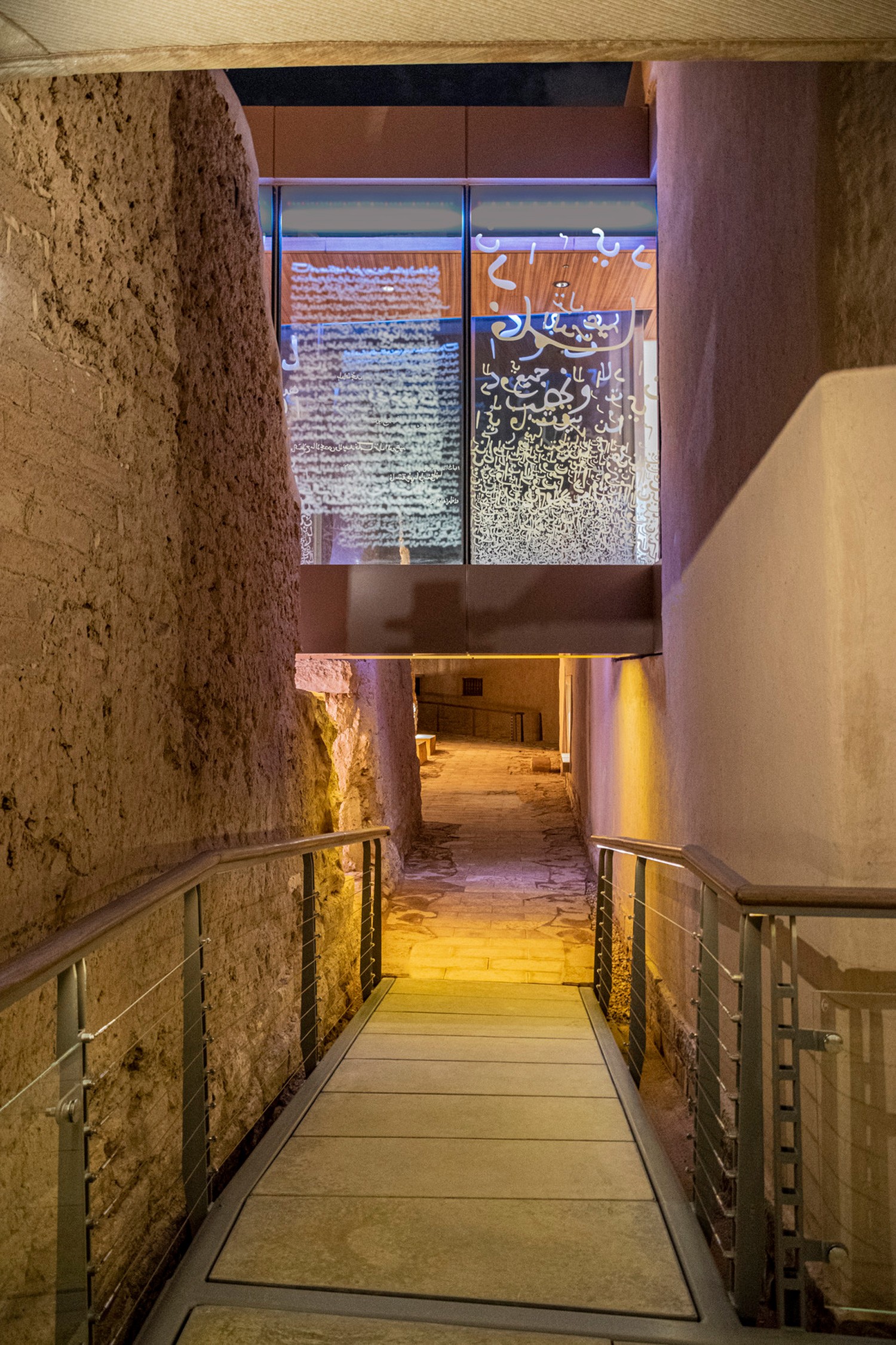 The walkway moves between palace units and under a glass bridge located in the museum.
