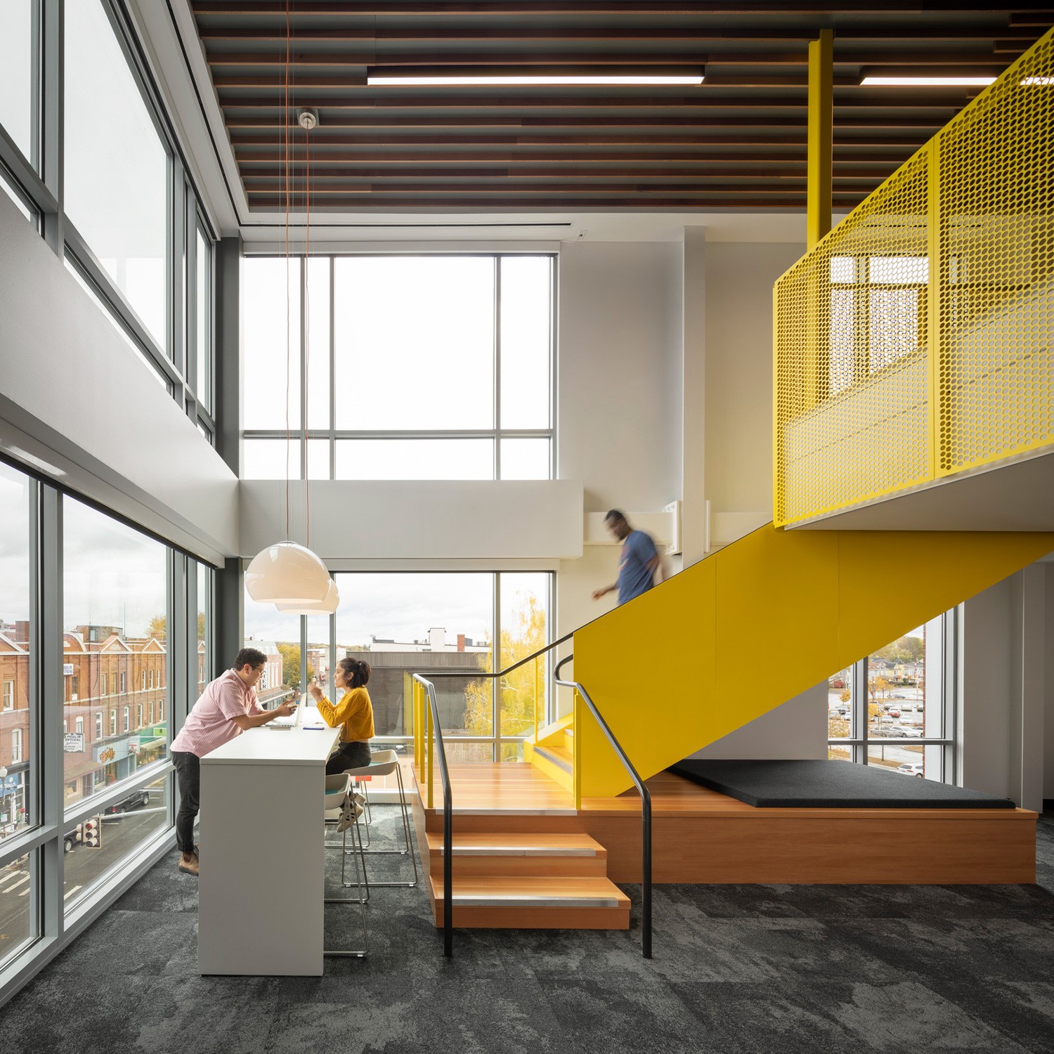 Double-height social lounge in Alfond Commons at Colby College