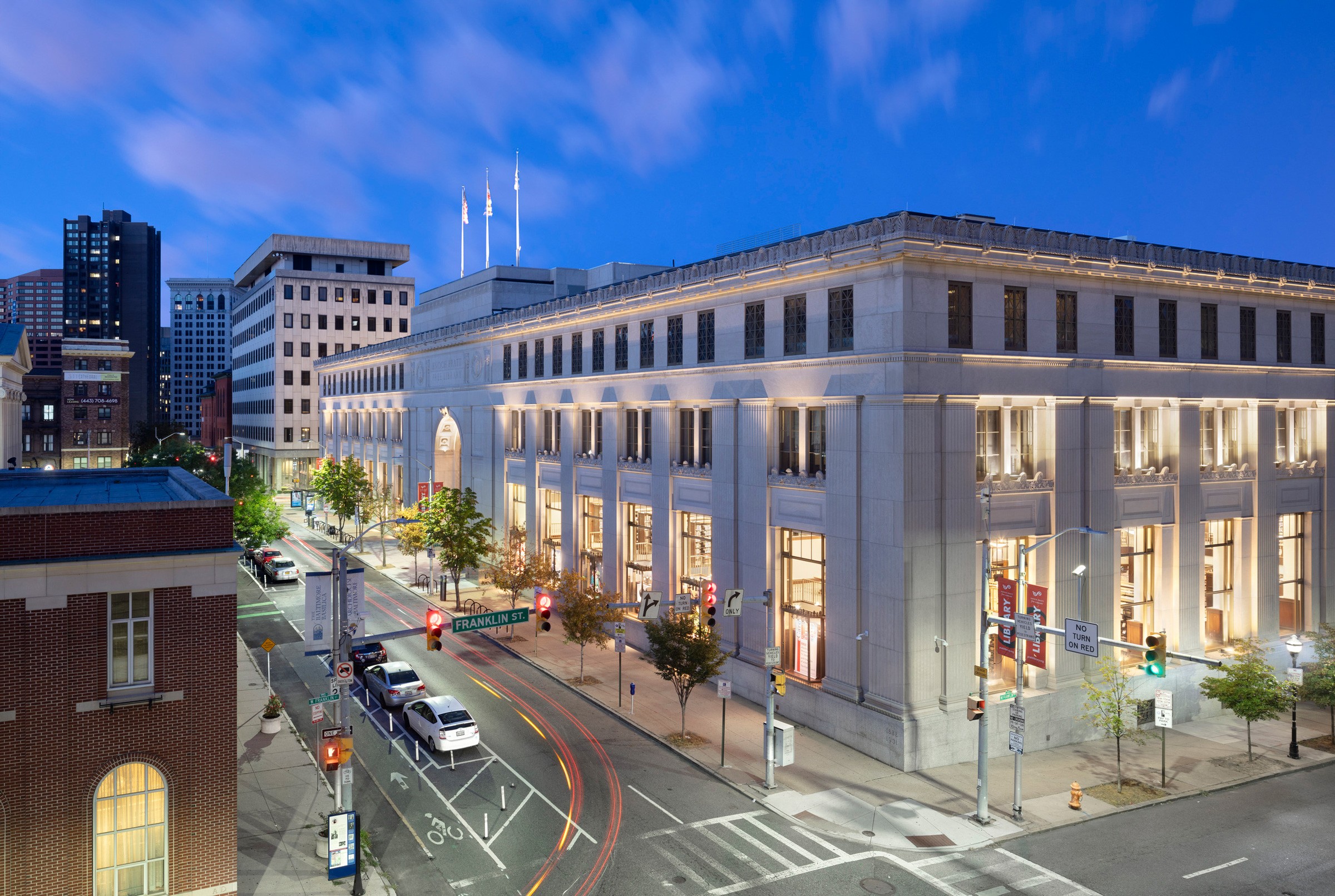 Exterior view at night of the Enoch Pratt Free Library Central Library Renovation