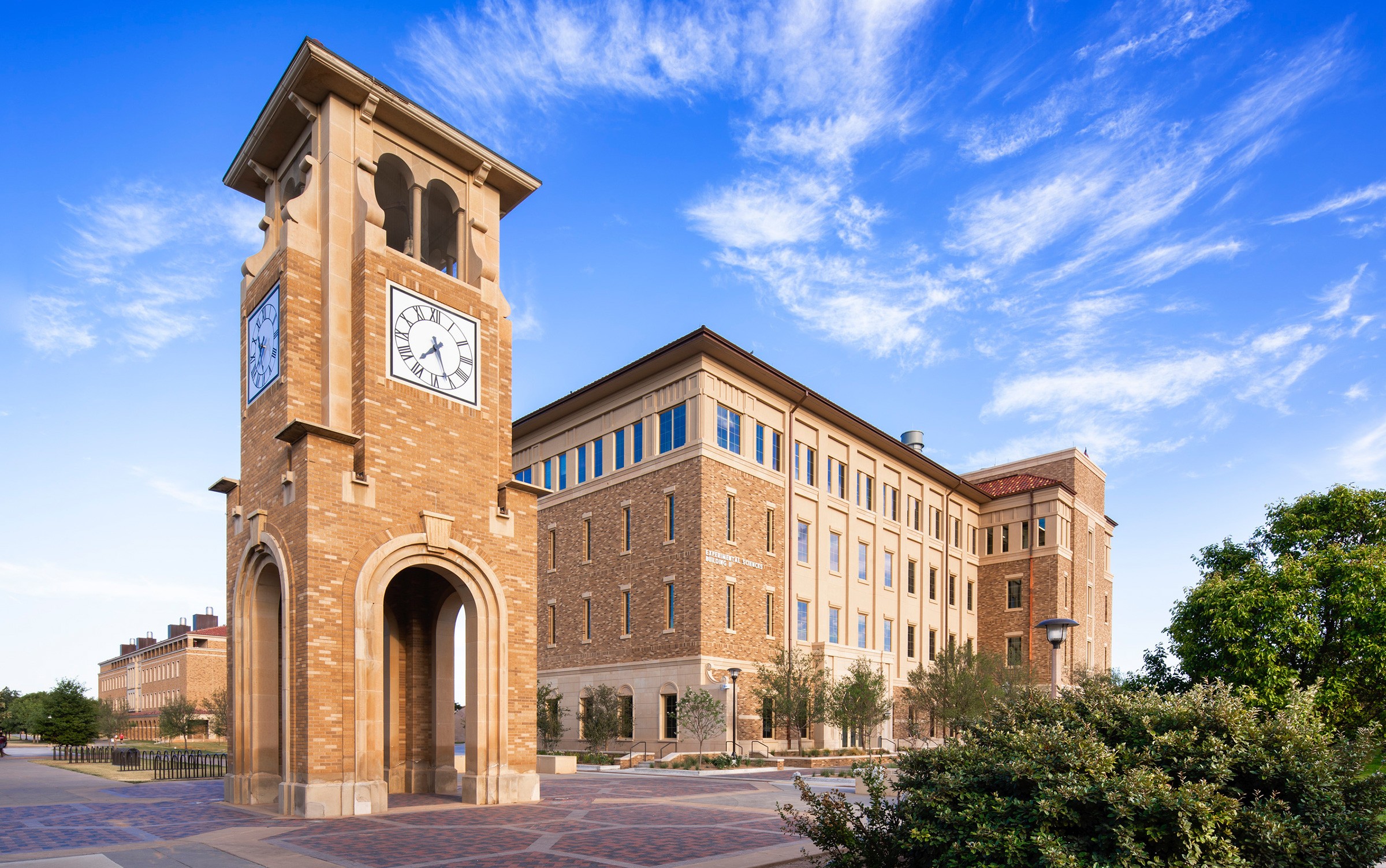 Exterior daylight image of the Texas Tech University Experiential Sciences Building with clocktower in the foreground