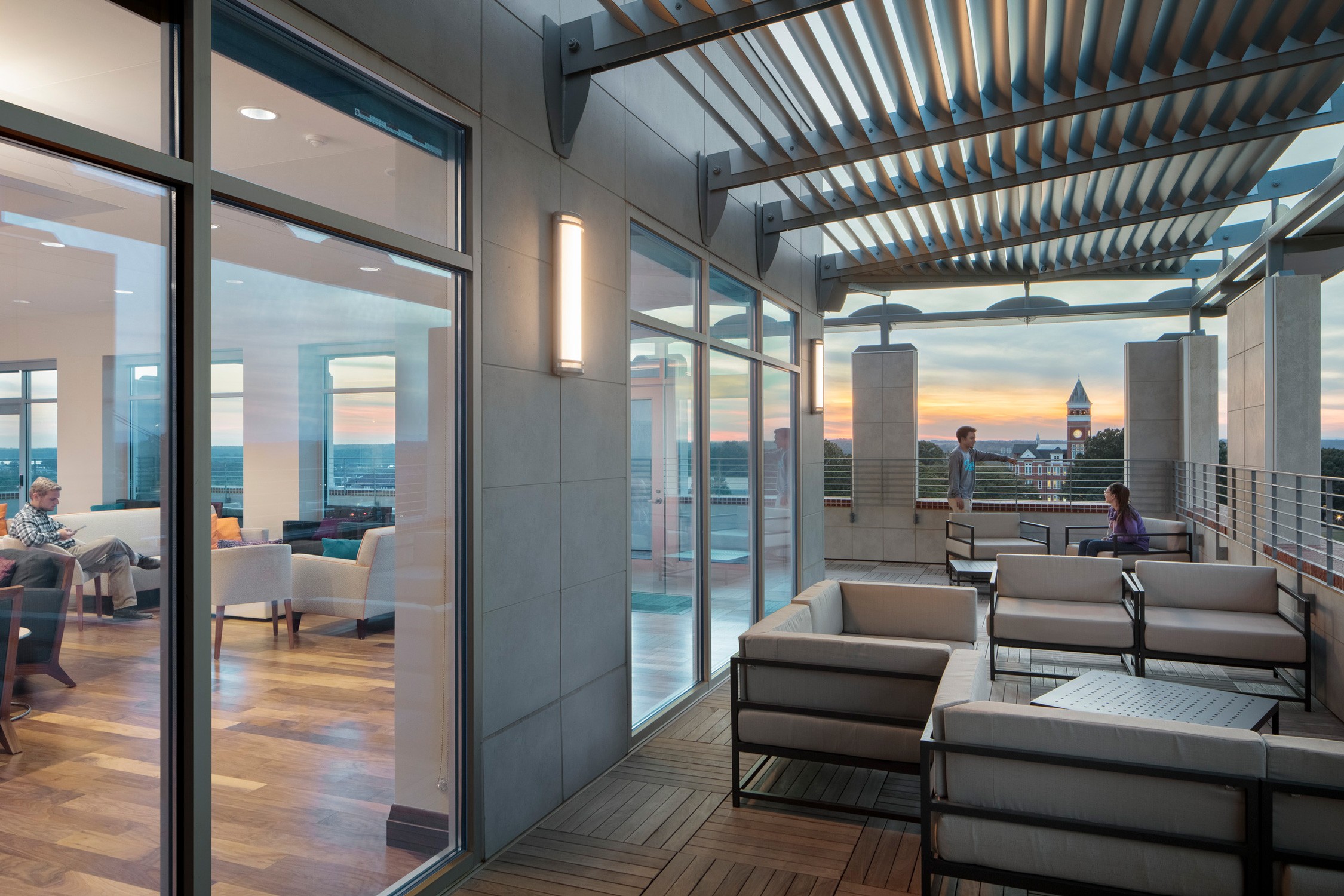 A view from a balcony looking toward the main campus at dusk at the Douthit Hills Development at...