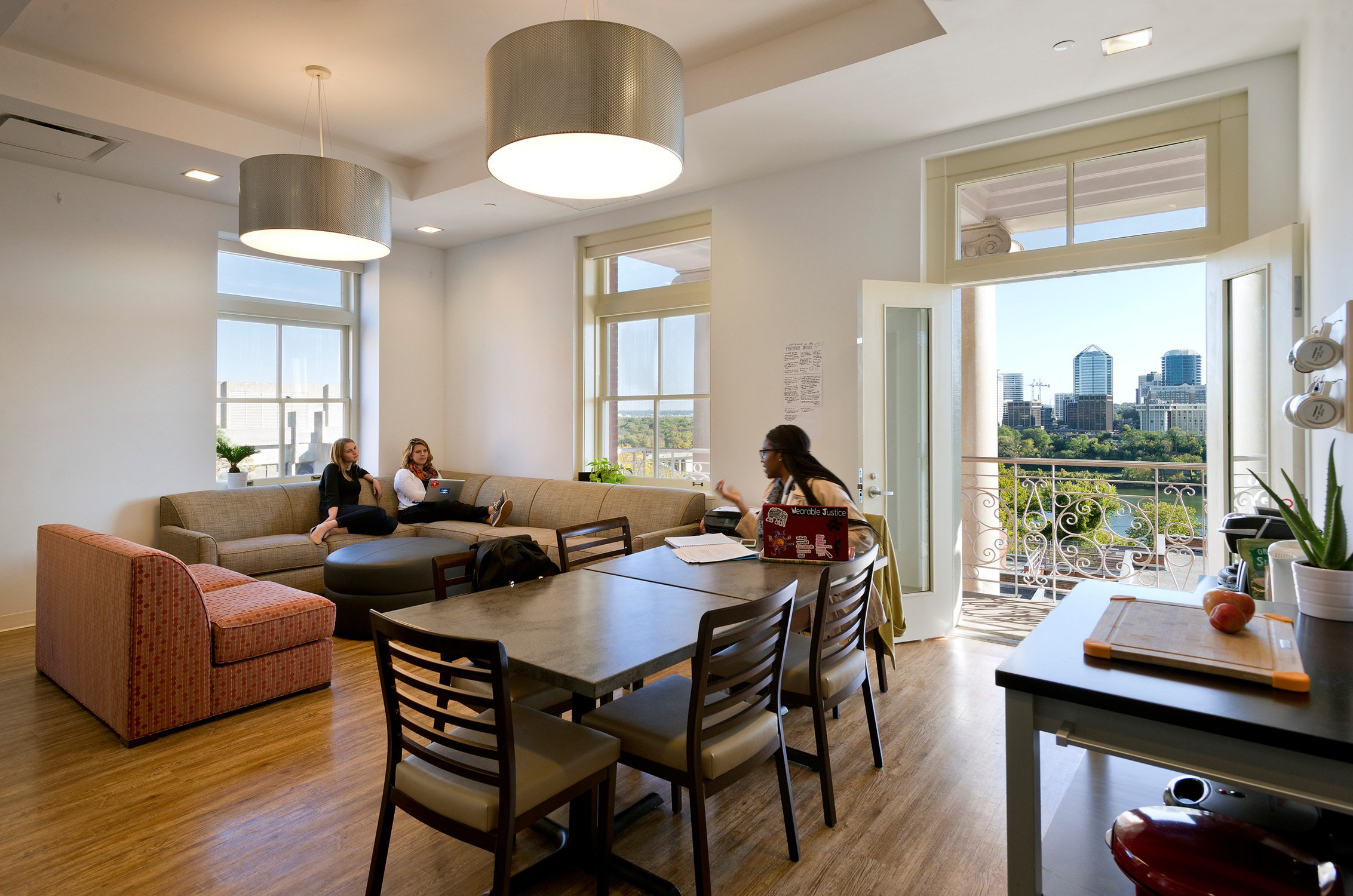 Interior view of unit with balcony and views to the city in Ida Ryan and Isaac Hawkins Halls at...