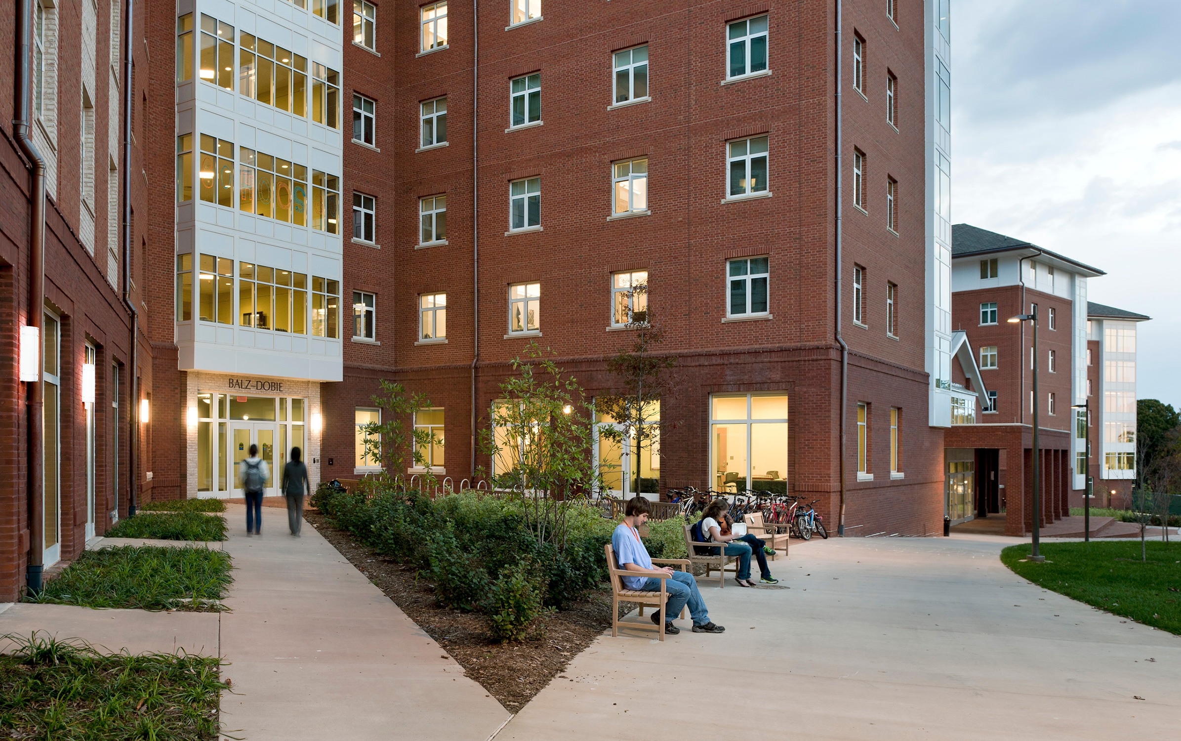 Exterior view of the Alderman Road Student Housing at University of Virginia at dusk. Students...