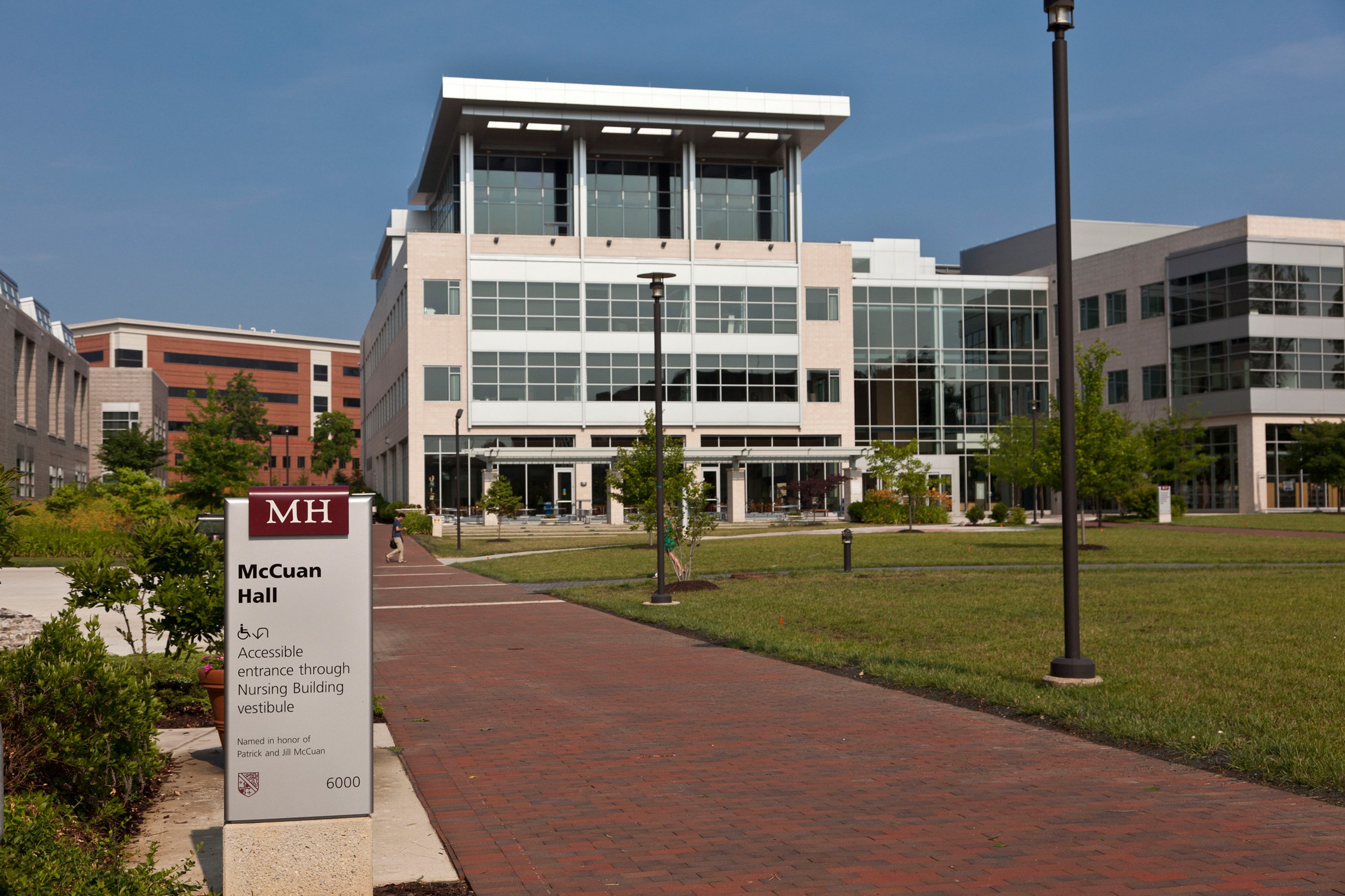 Building identification and handicap accessible entrance sign.