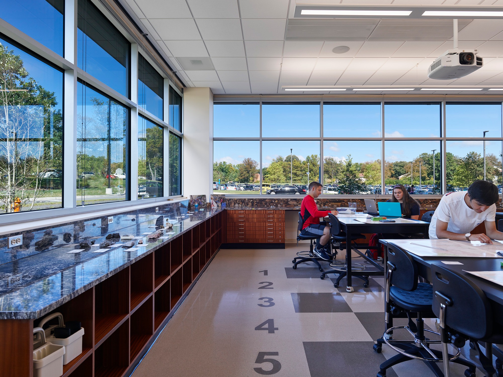 A flexible, laboratory classroom featuring panoramic windows and students studying.