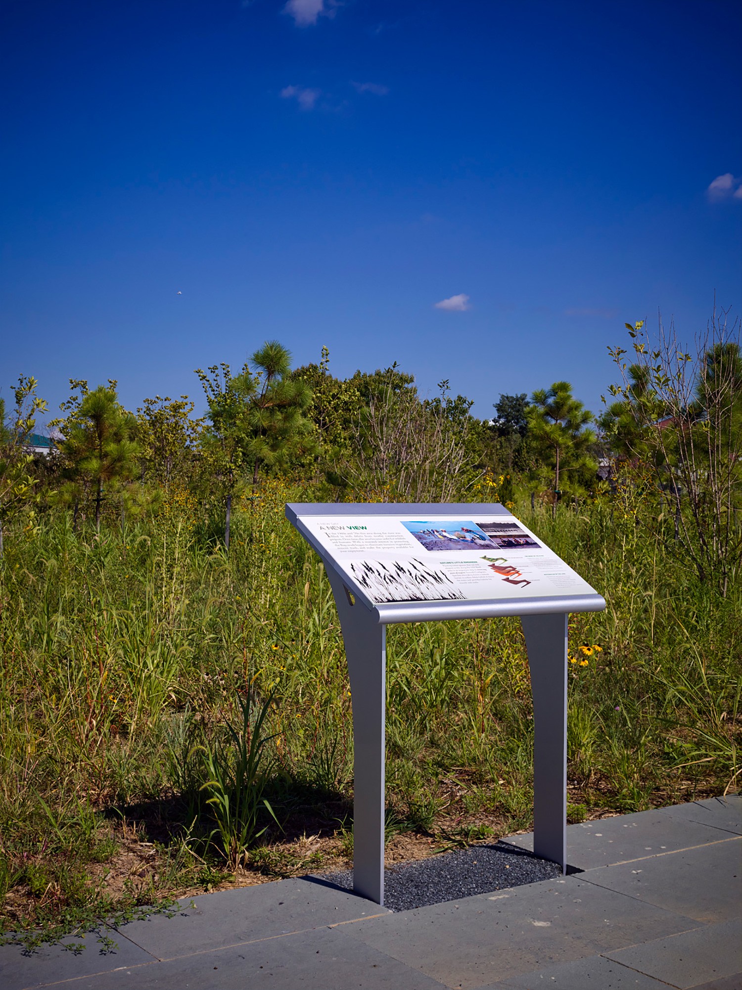 View of an educational sign at the National Aquarium West Covington Park