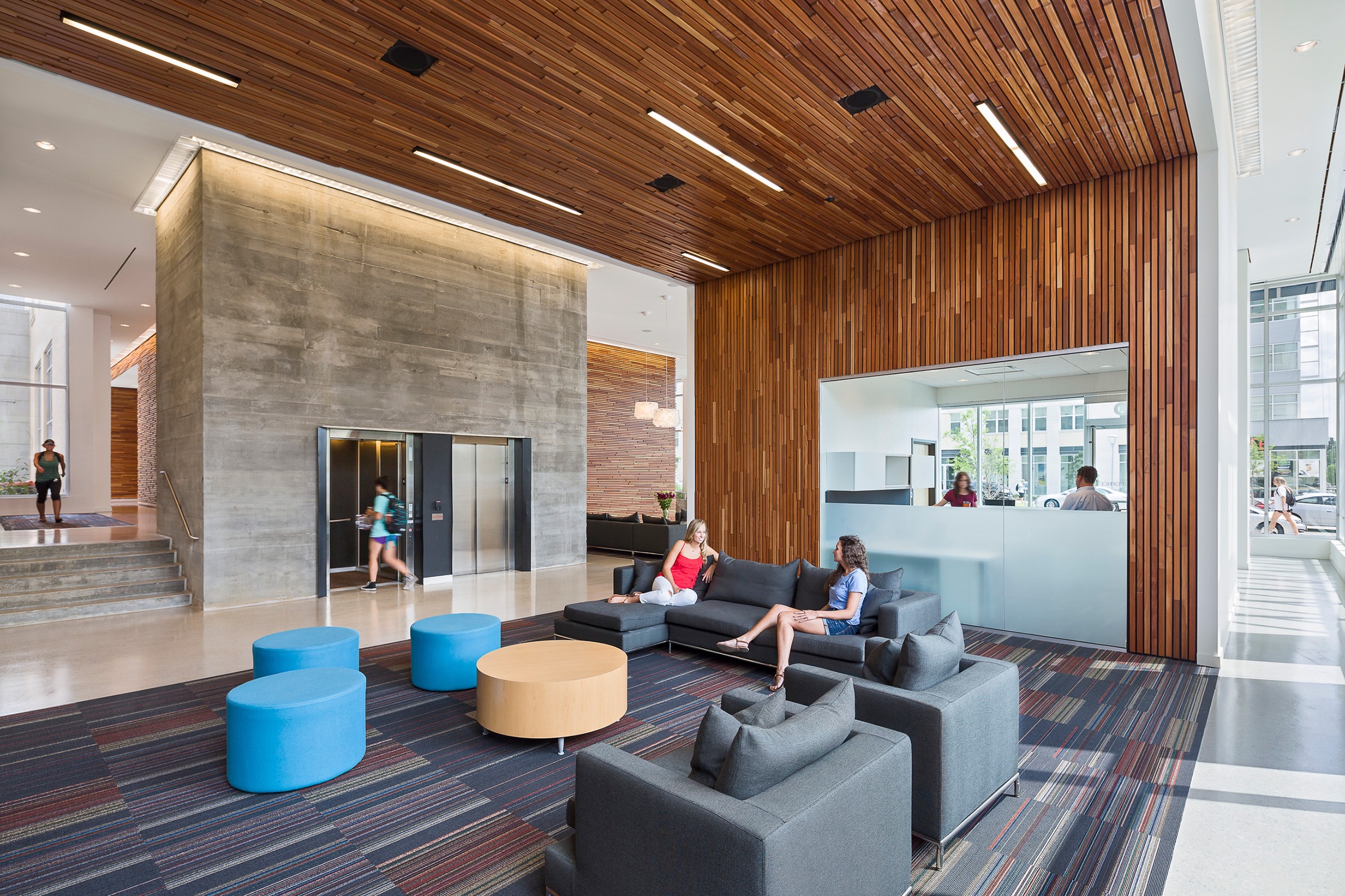 Interior view of residents conversing in the space in 650 Lincoln at the University of South Carolina...
