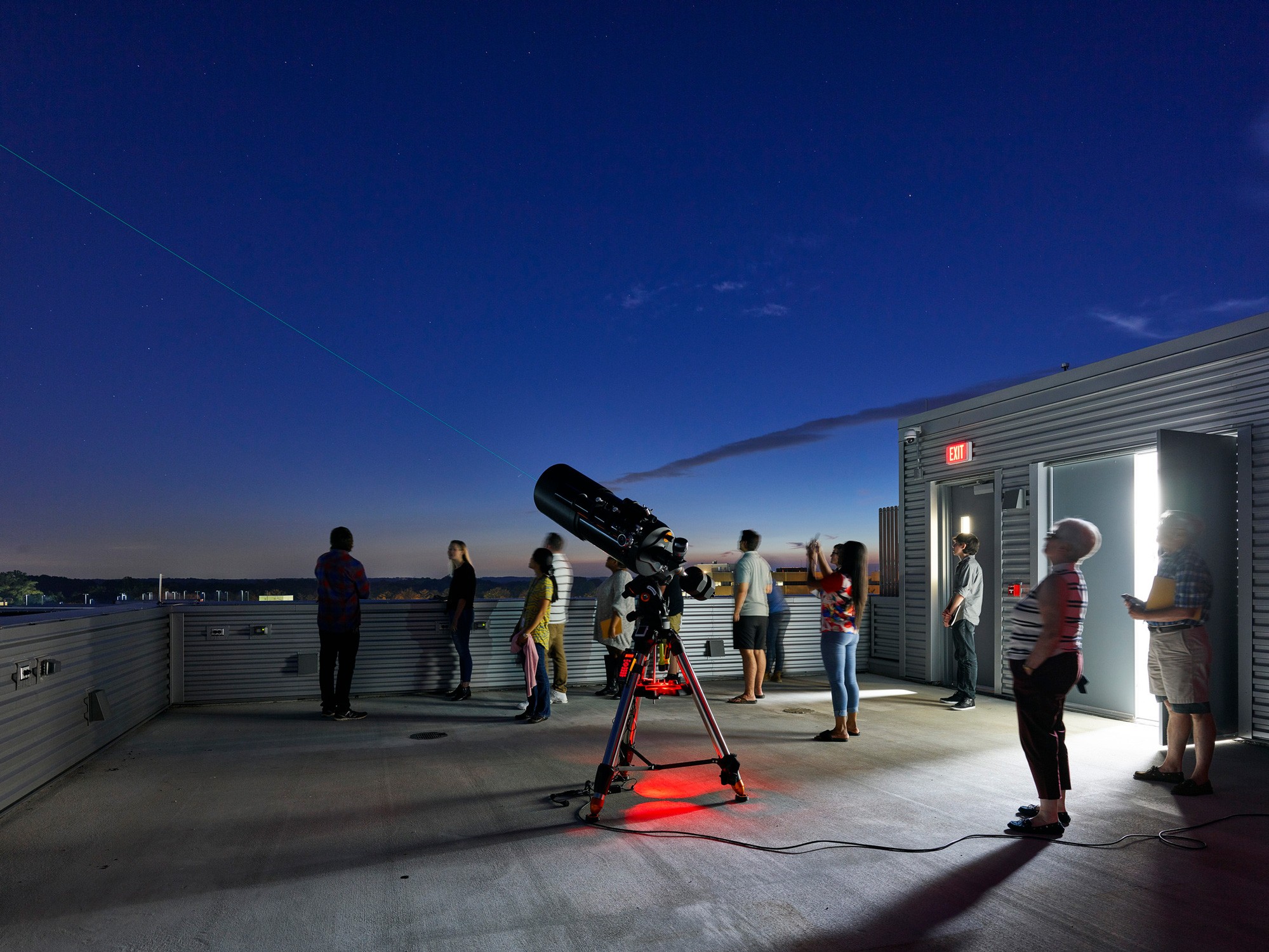 A rooftop telescope observatory with state-of-the-art equipment.