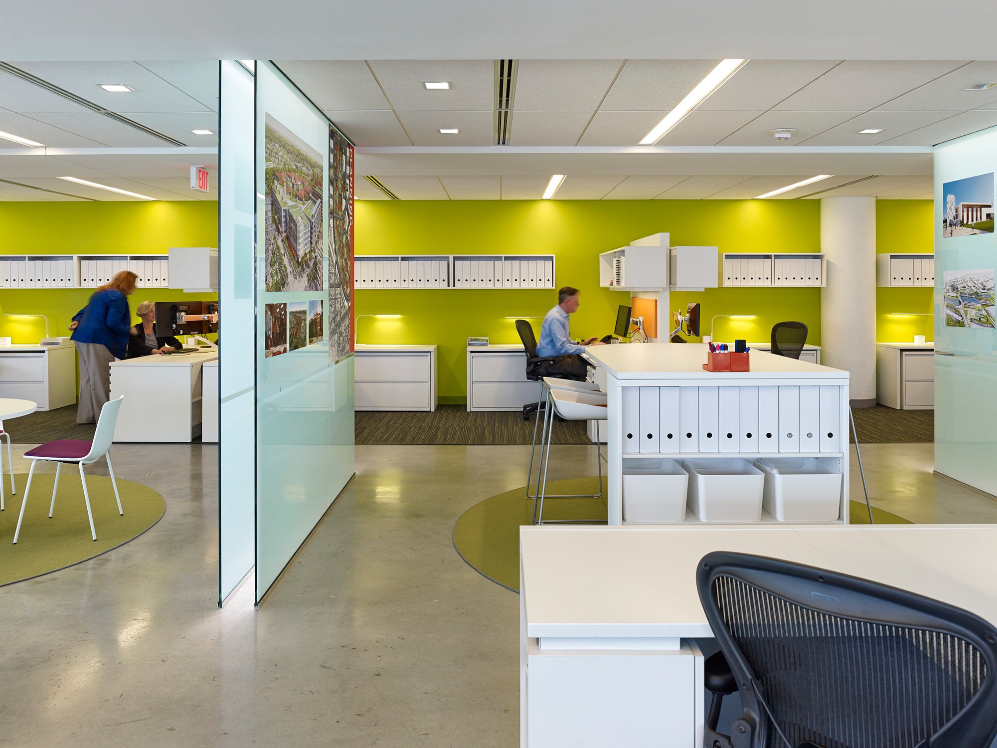 Ayers Saint Gross DC office interior view of glass partitioned collaboration spaces in the foreground...
