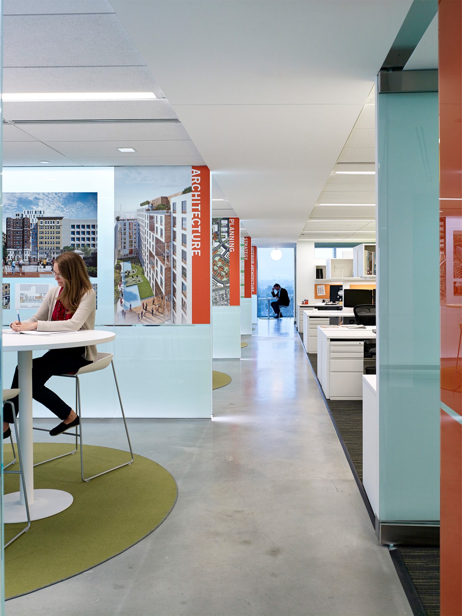 View of the Ayers Saint Gross DC office spine with glass-partitioned collaboration spaces to the...
