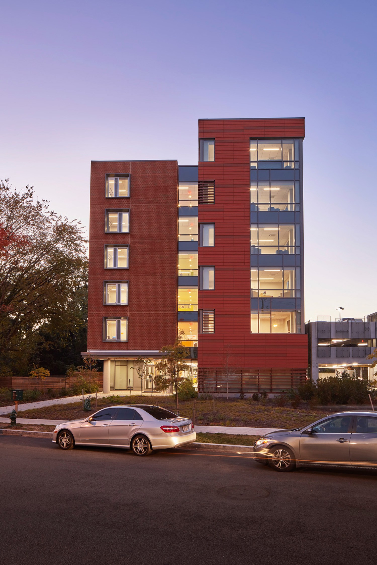 Dusk elevation showcasing the community lounges at The Brooks