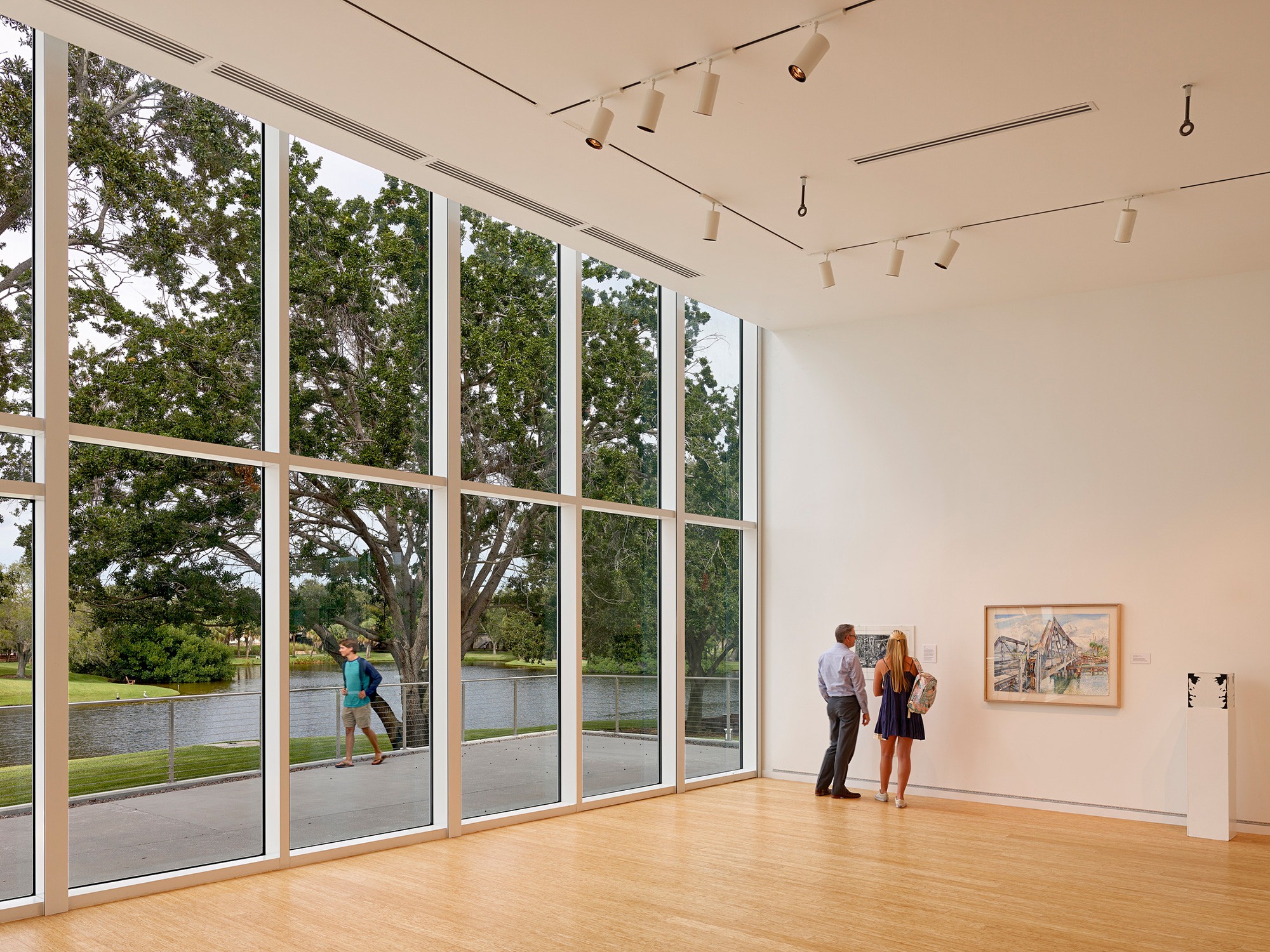 Interior image of gallery space with floor-to-ceiling windows at the Helmar and Enole Nielsen Center...
