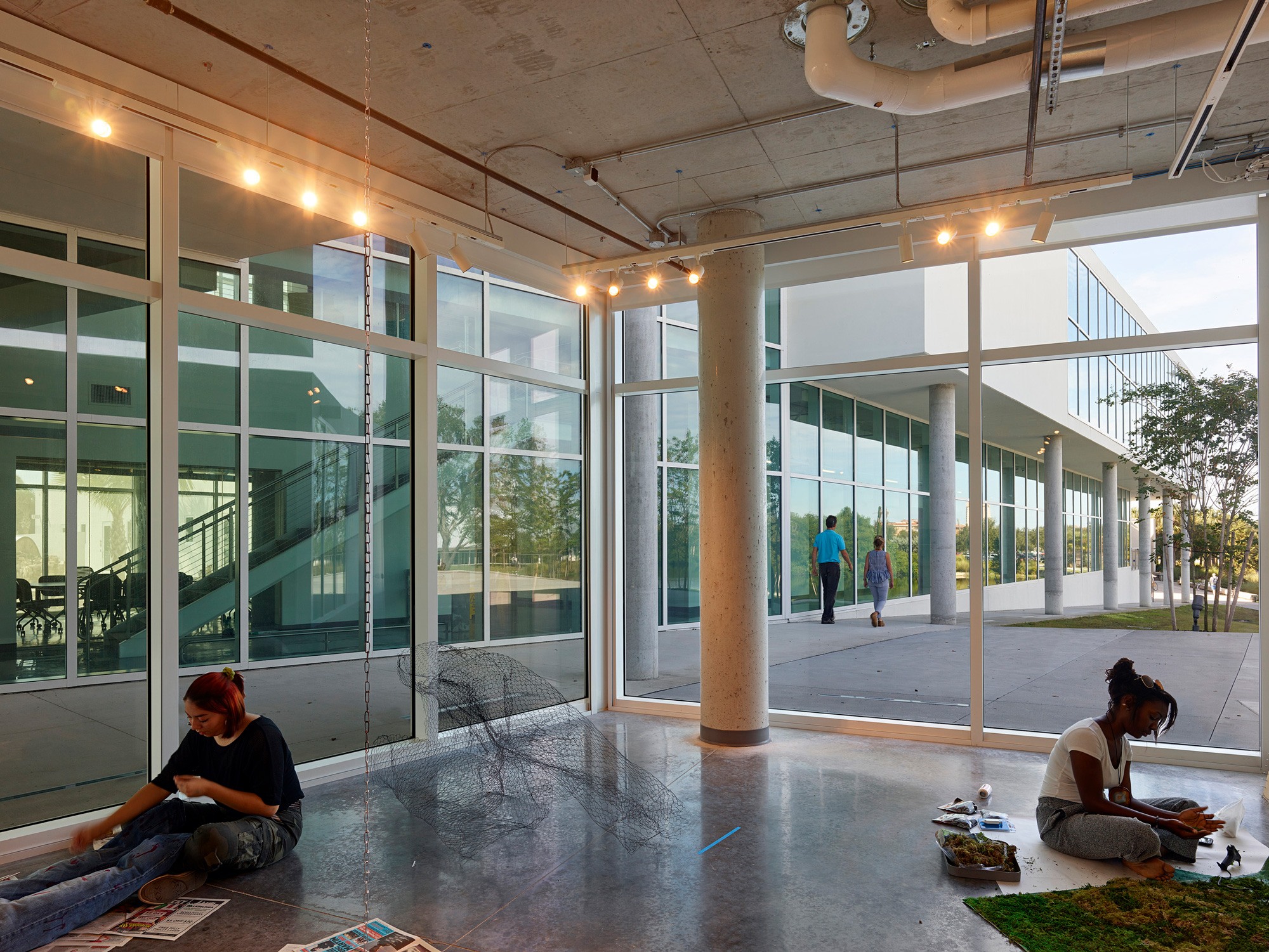 Interior image of students creating art on the floor at the Helmar and Enole Nielsen Center for...