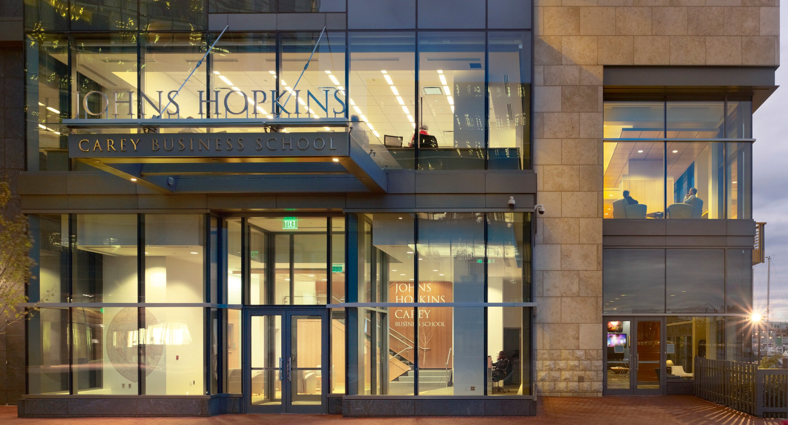 Exterior dusk shot of the Johns Hopkins University Carey School of Business