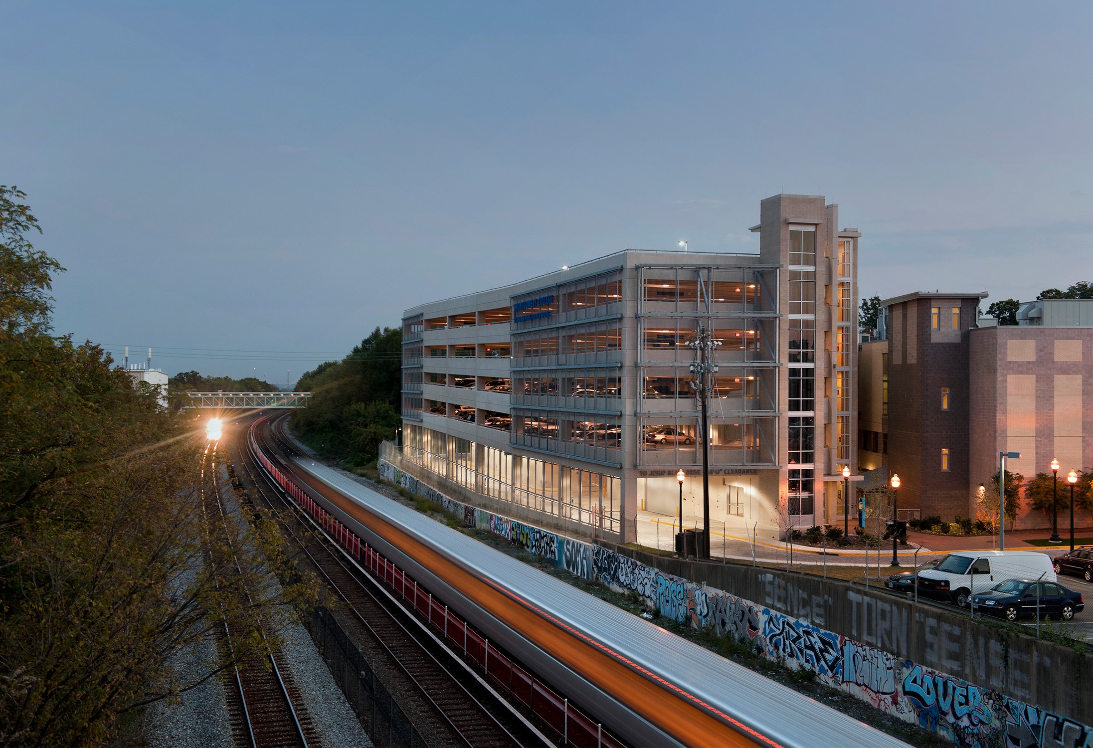 Dusk shot of the parking garage adjacent to the WMATA red line and CSX tracks for Montgomery College