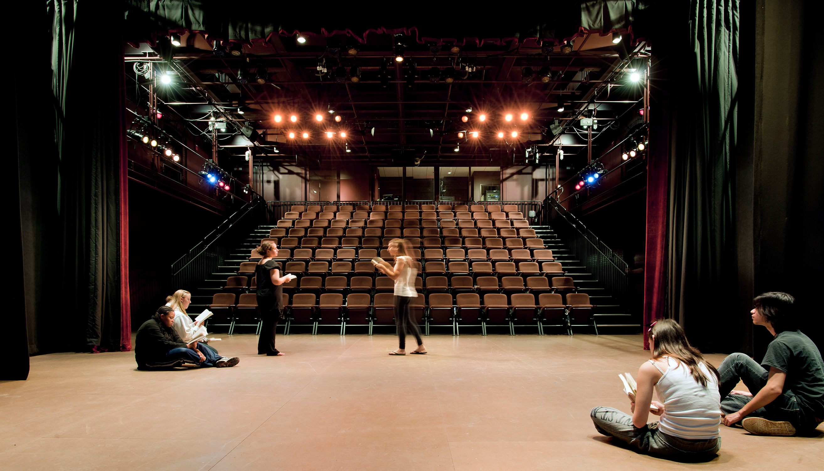 Students rehearse a play in the 280-seat stadium seated theater at the Delaplaine Fine Arts Center...