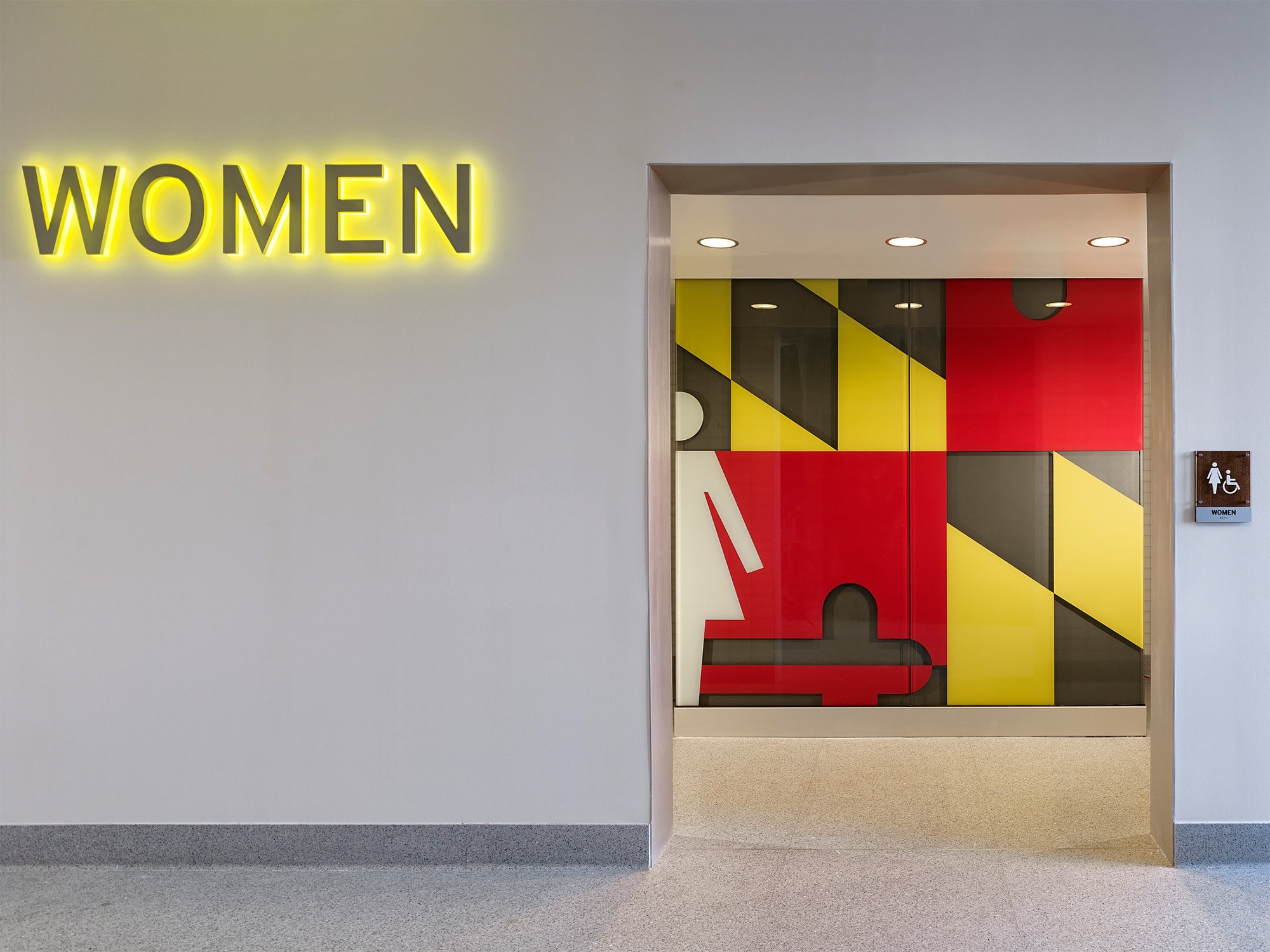 Bathroom signage and wayfinding for the Maryland House Travel Plaza for AREAS USA.