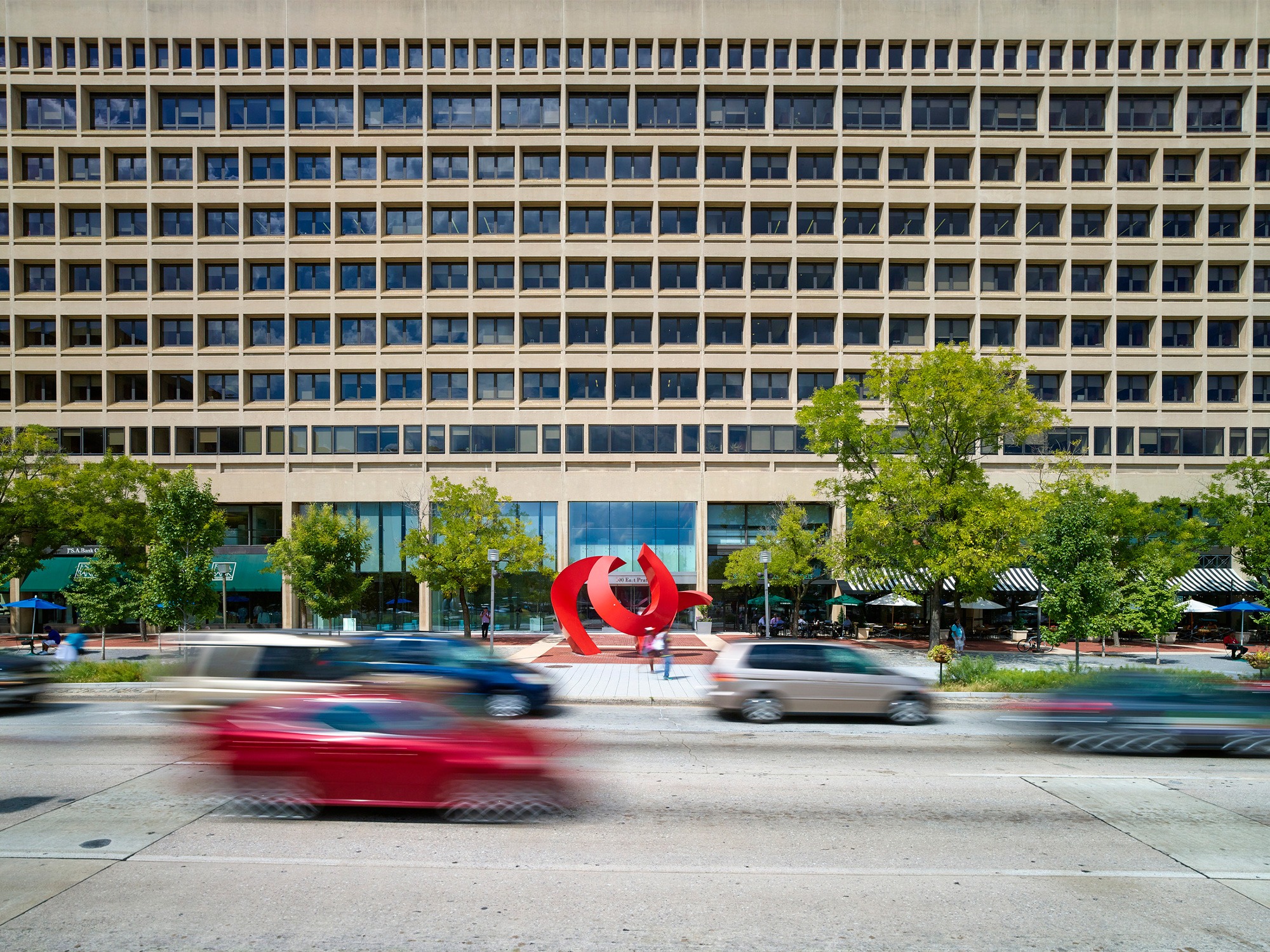 Sidewalk view looking north up redeveloped Pratt Street toward storefronts