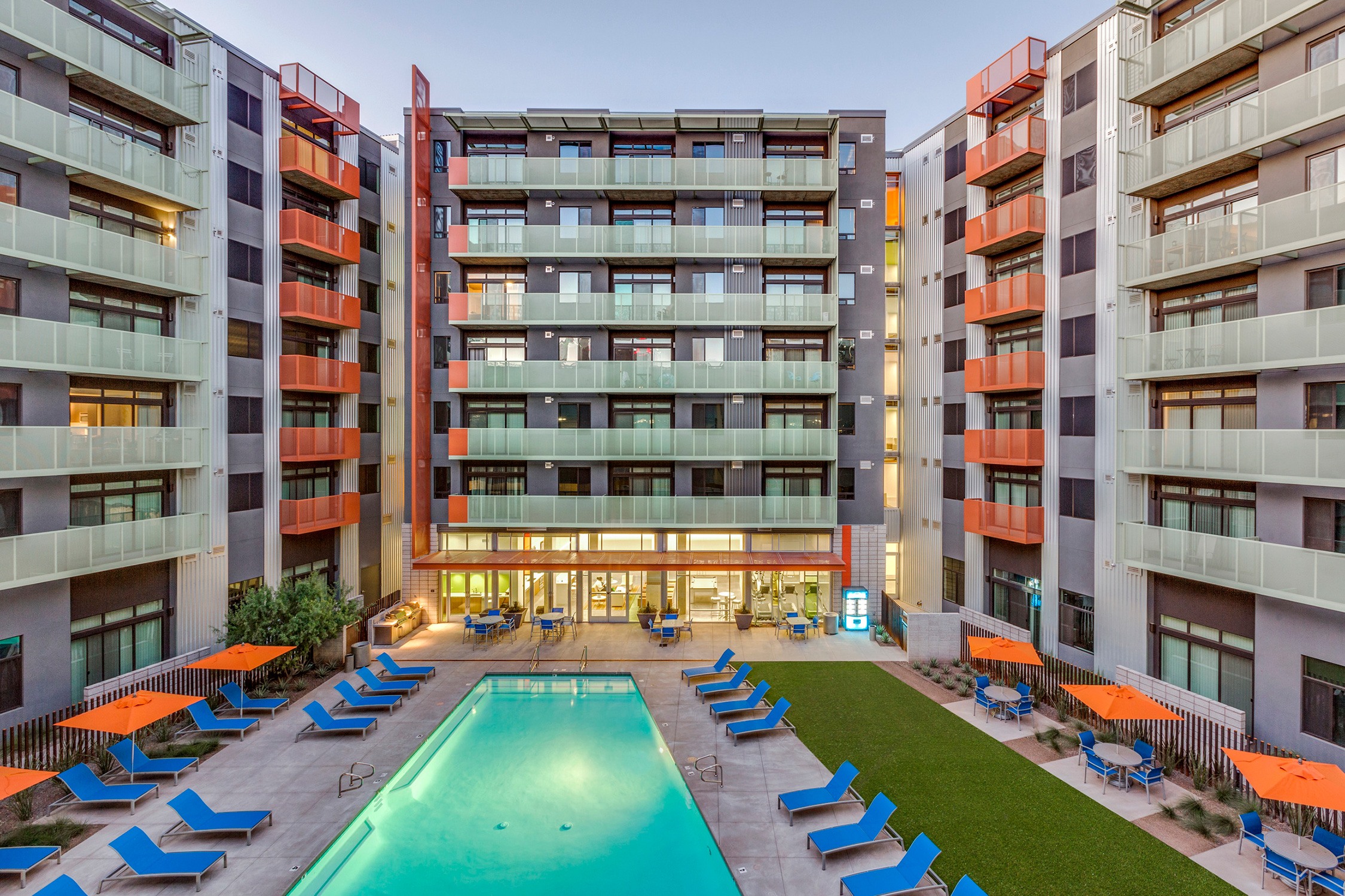 Roosevelt Point courtyard and pool with blue and orange exterior furniture