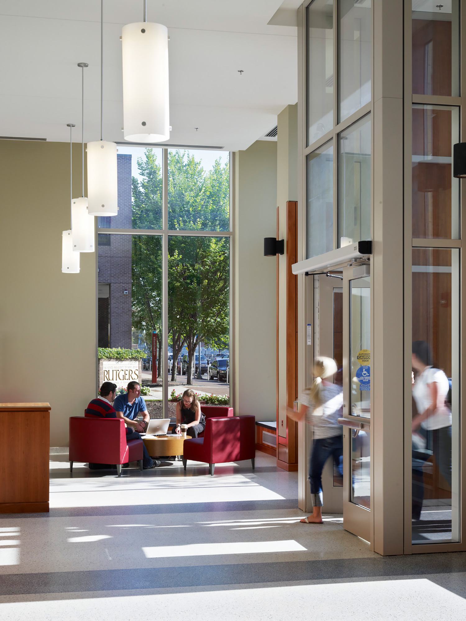 Students work in the lobby near the entrance to the Rutgers University School of Law Title: Interior...