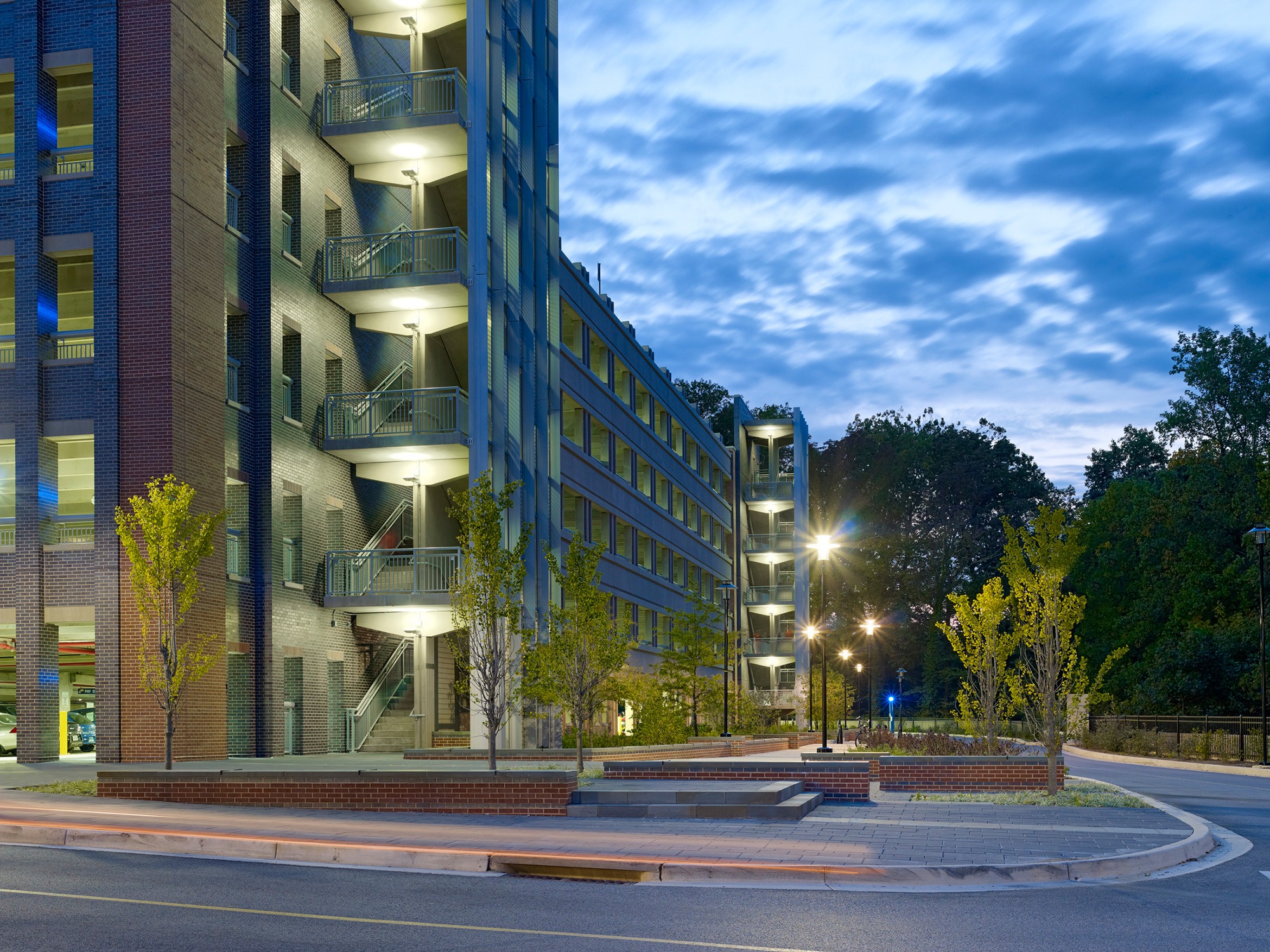 Tiered plaza in front of garage at dusk