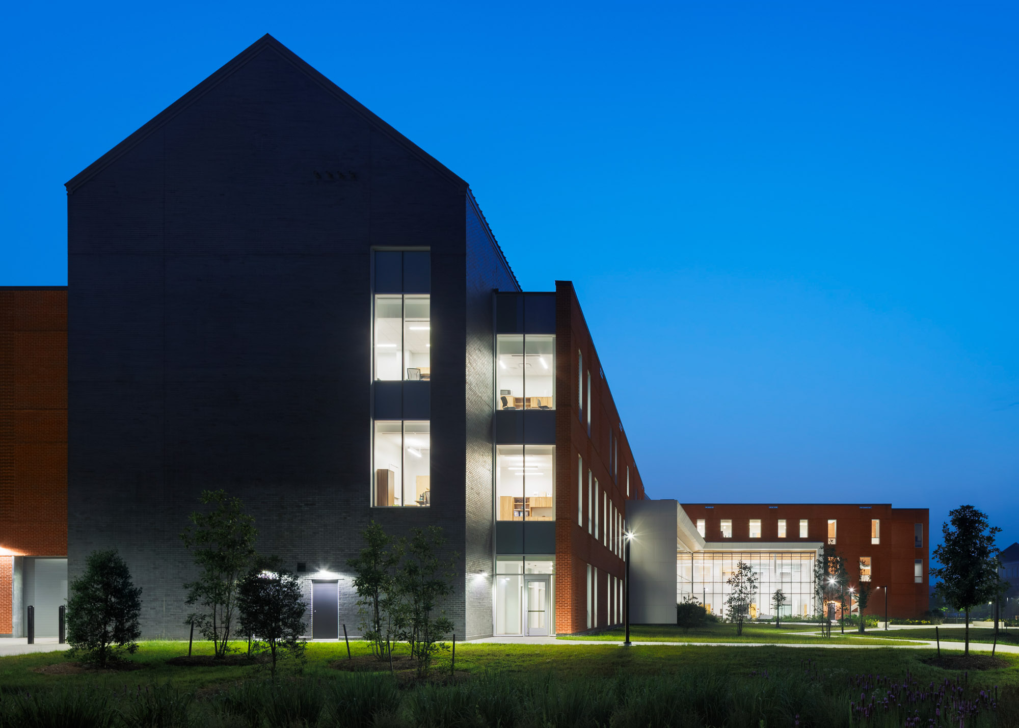 A side view of the University of Maryland Eastern Shore School of Pharmacy at night