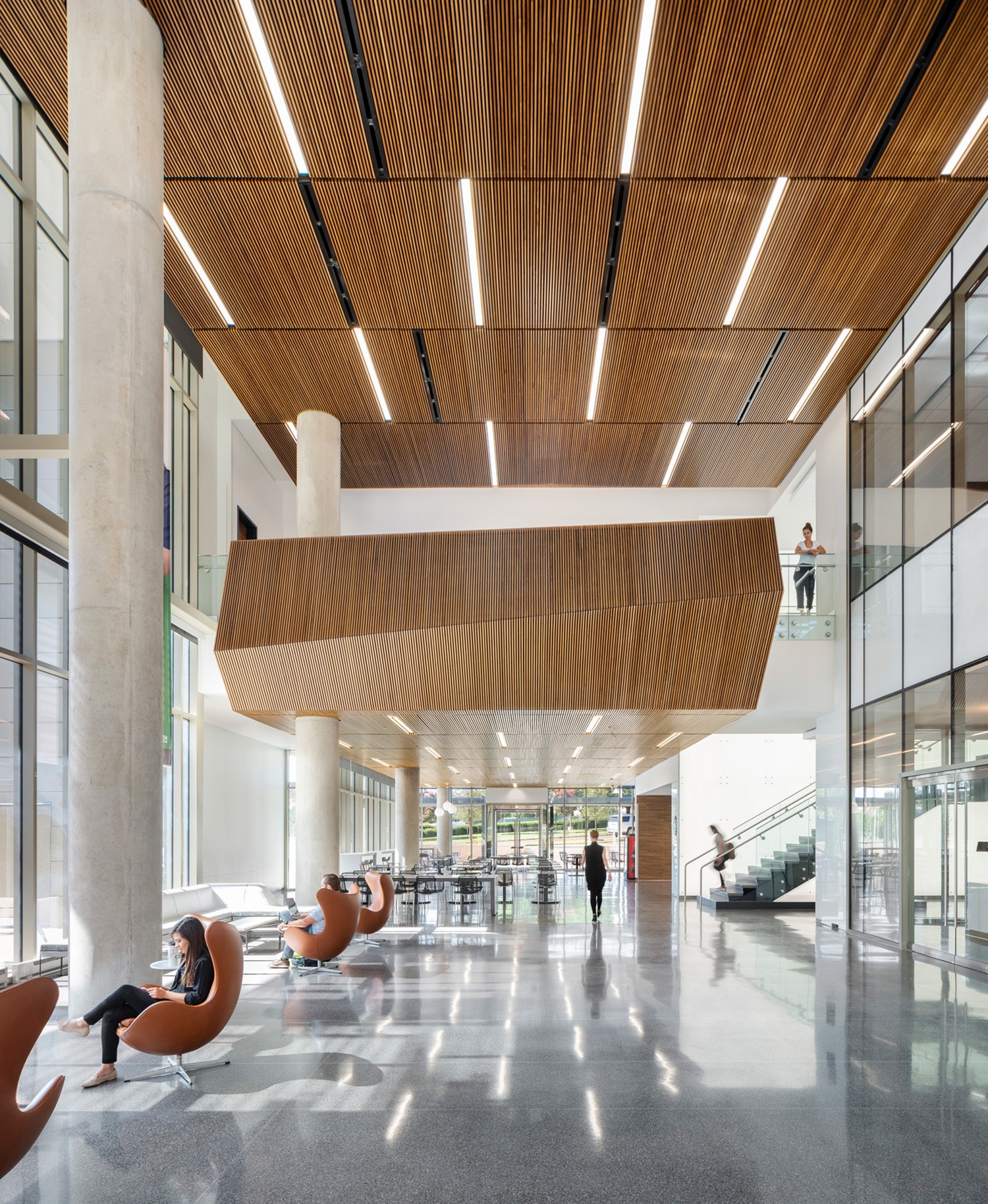 Expansive interior lobby image with beautiful wood paneled ceilings and lots of natural light at...