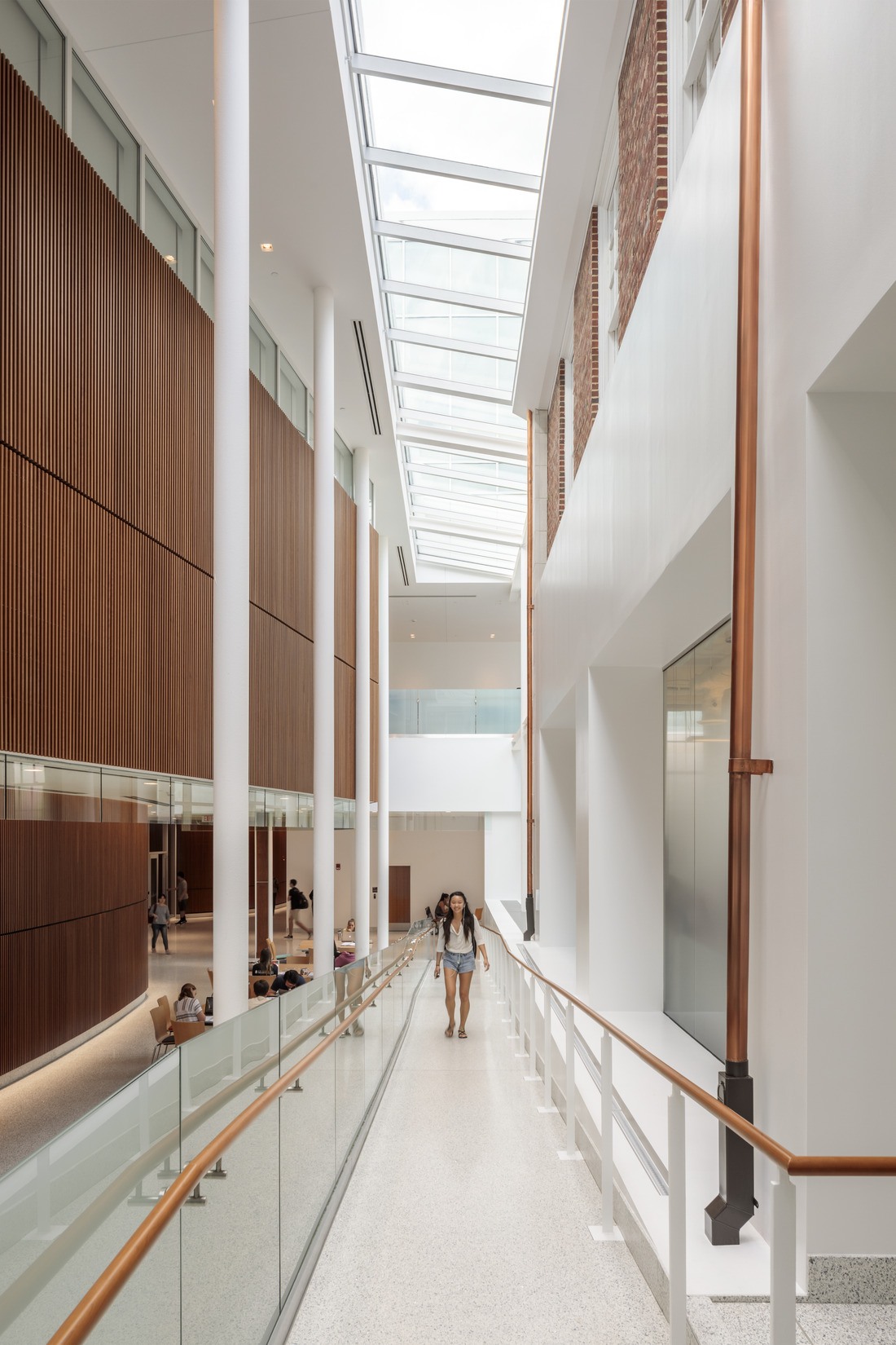 Hallway along old and new sections of the project at the Edward St. John Learning and Teaching...