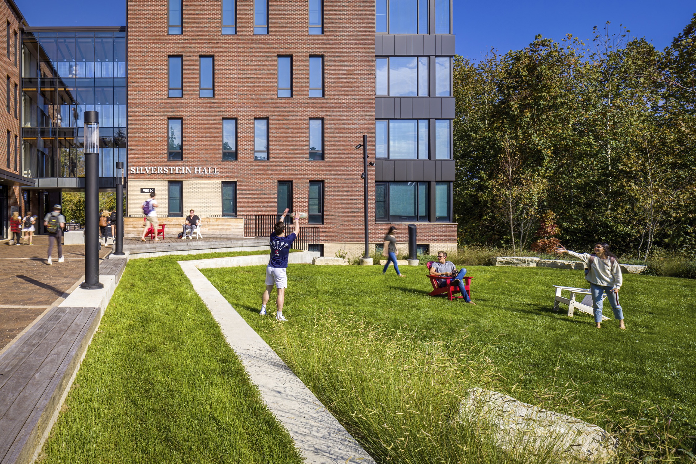 Student relaxing on the quad of Silverstein Hall at Denison University