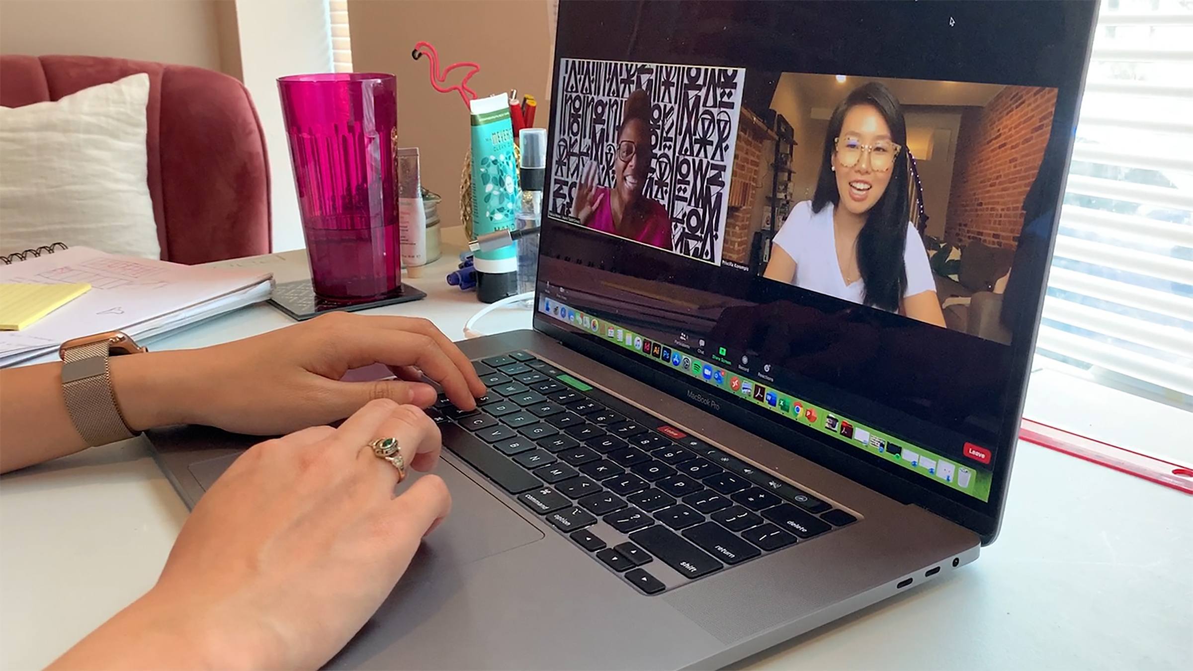 A person engaged in a virtual meeting on a laptop.
