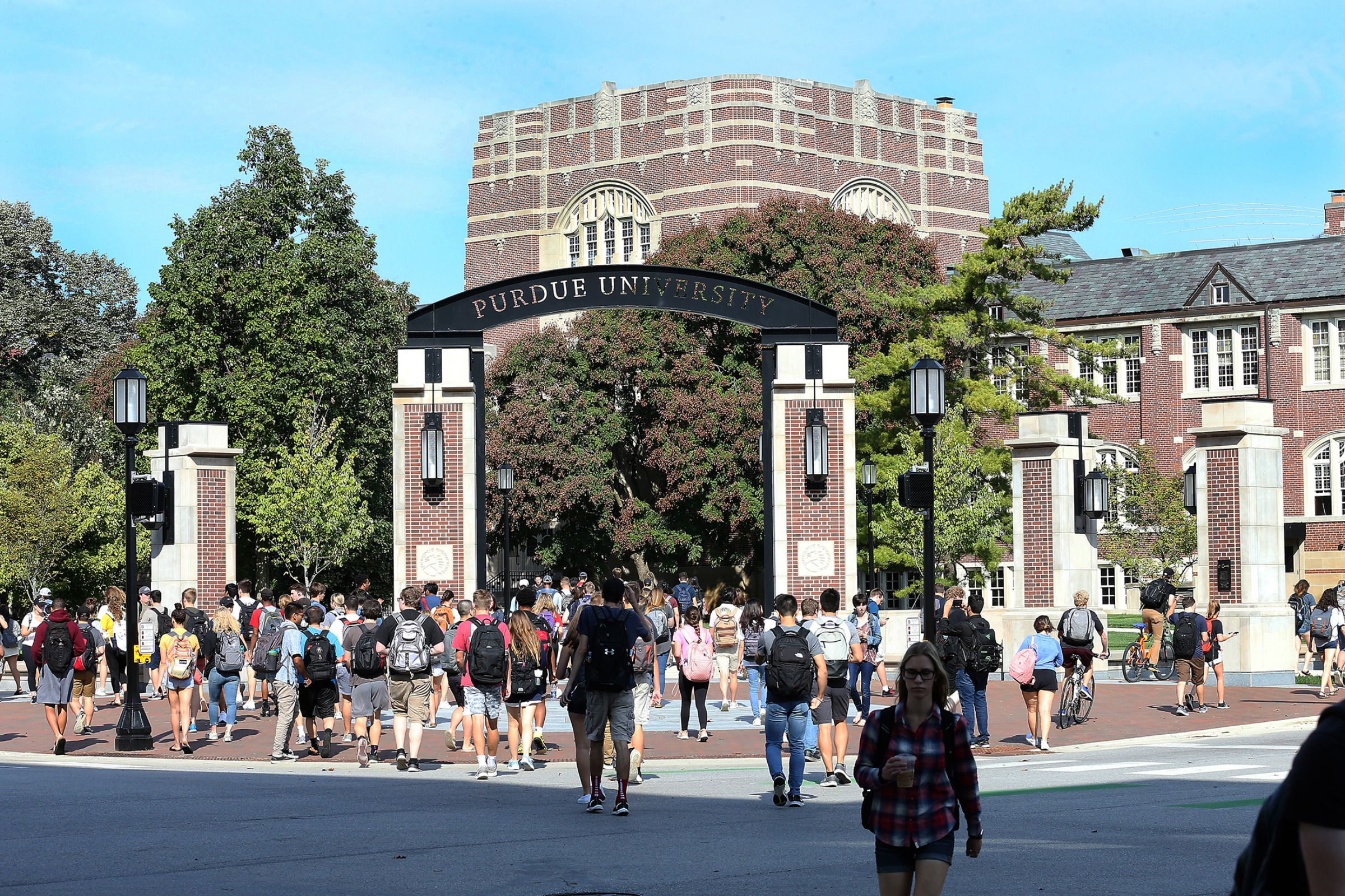 Students walk through the Purdue University Gateway