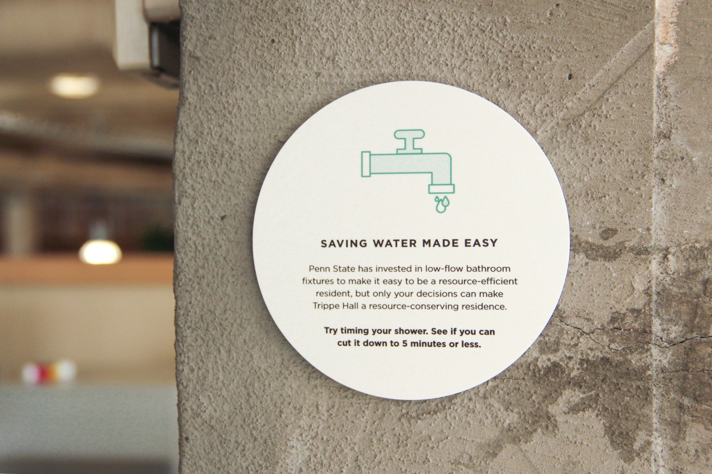 Signage encouraging responsible water use at Trippe Hall