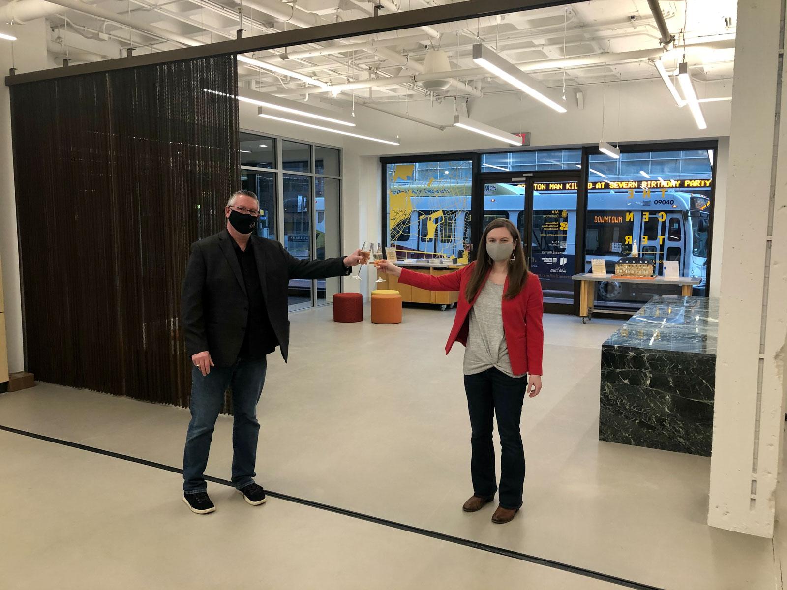 Laura Wheaton toasts with AIA Baltimore Past-President Scott McGovern