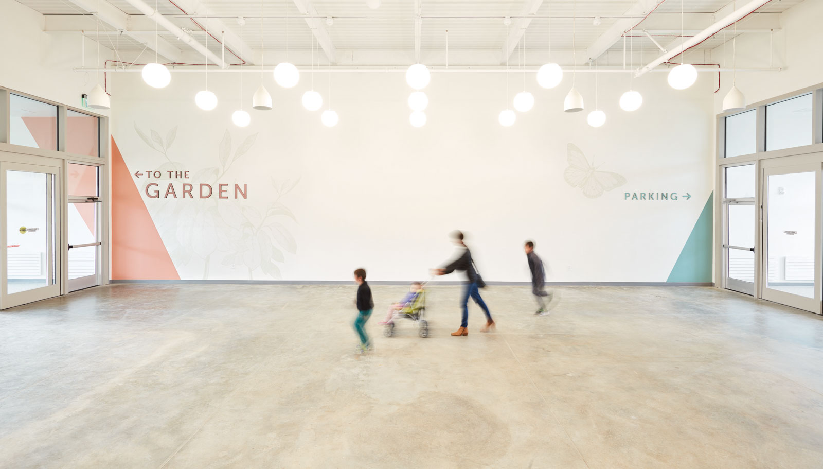 Visitors follow wayfinding signs to the garden