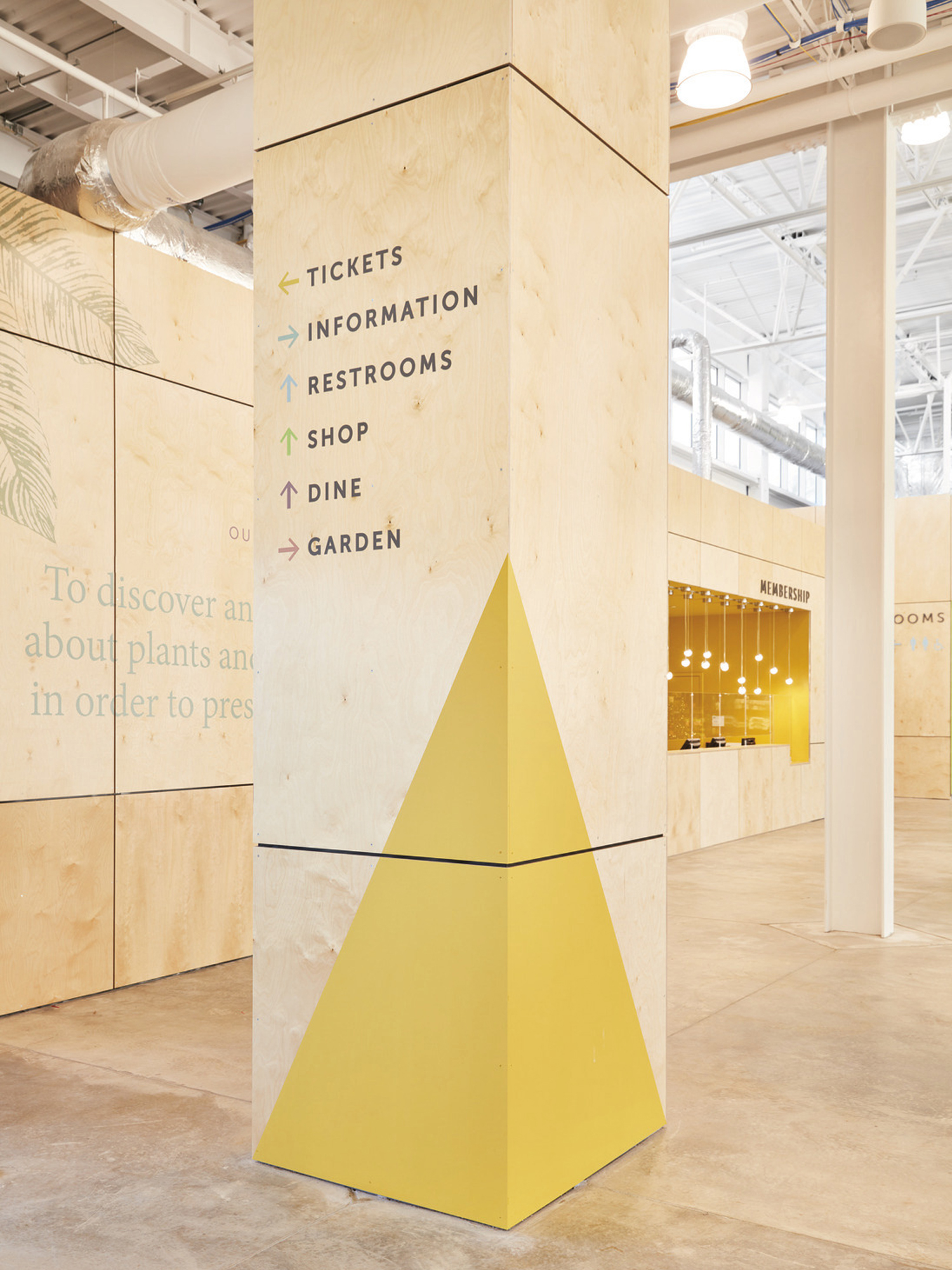 Colorful wayfinding inside the Phase One Visitor Center at the Missouri Botanical Garden