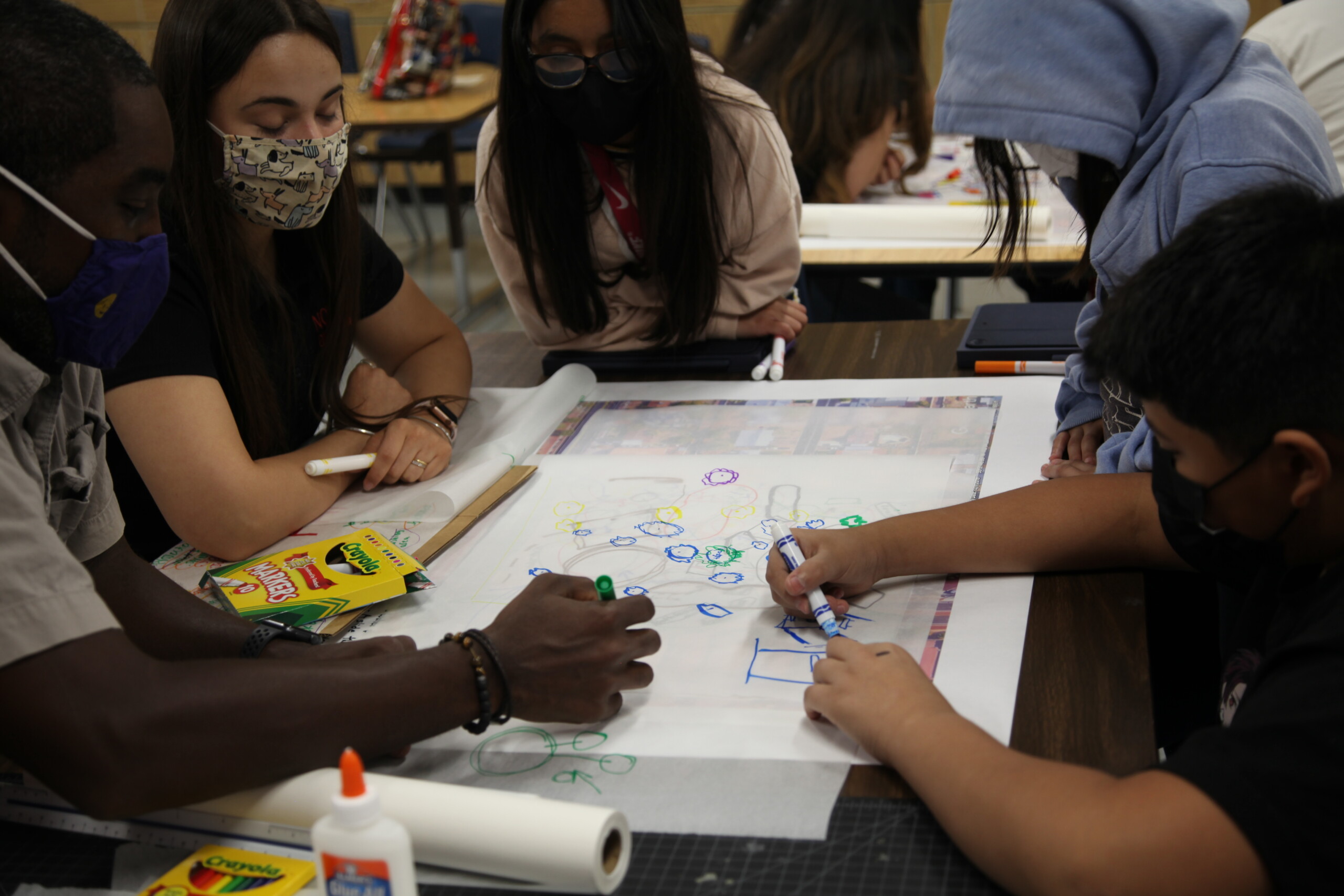 Architect Oriana Gil-Perez works with students during a NOMA-sponsored design workshop.