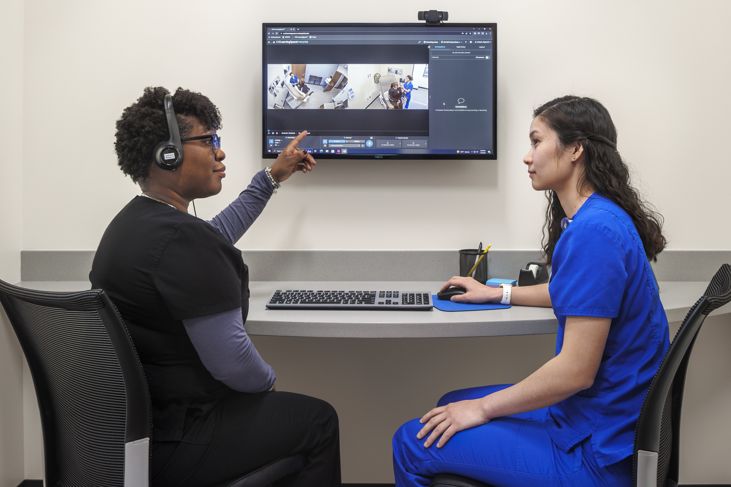 Duke nursing students discuss a simulation exercise.
