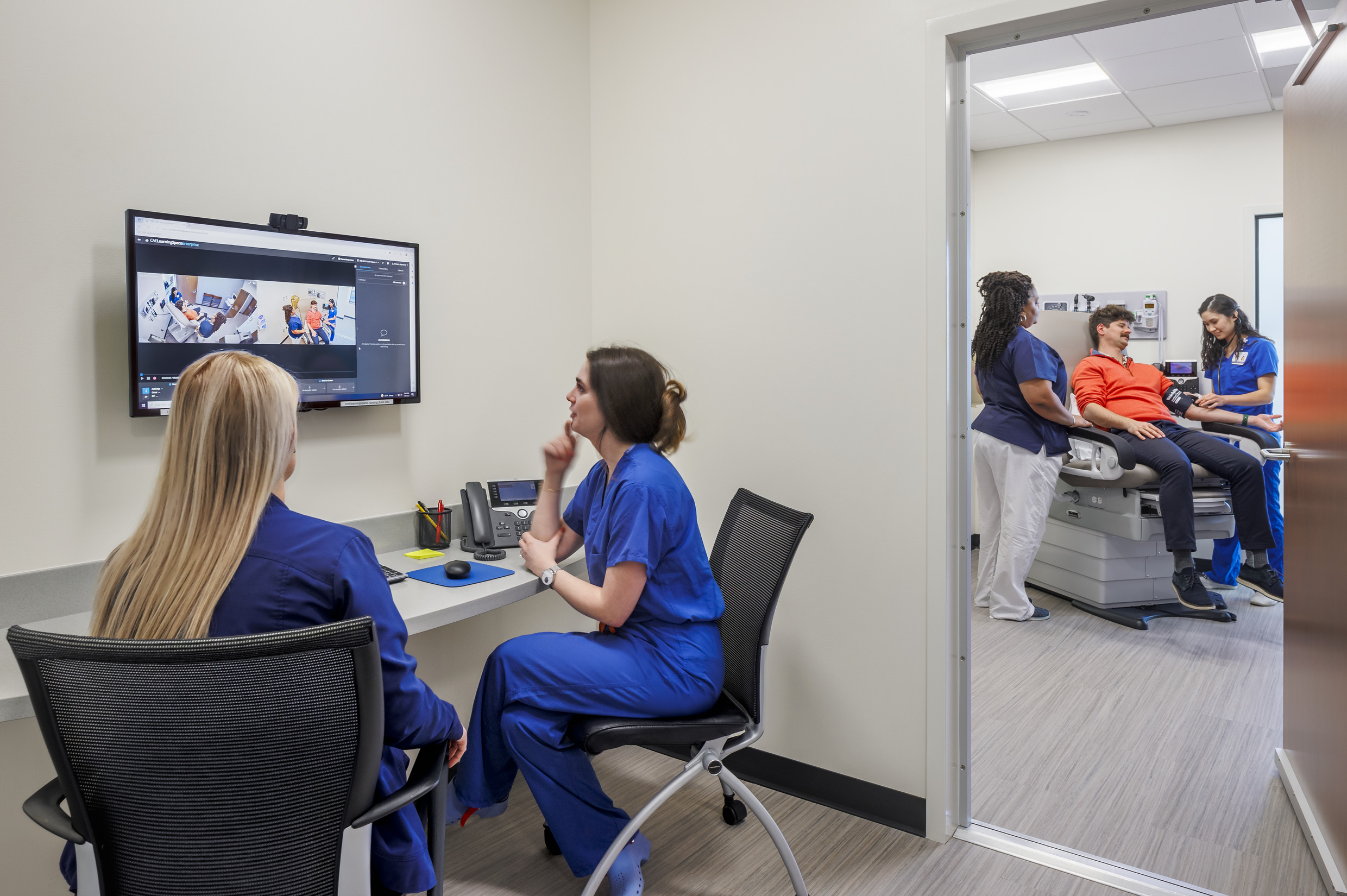 Duke nursing student observes a simulation exercise.