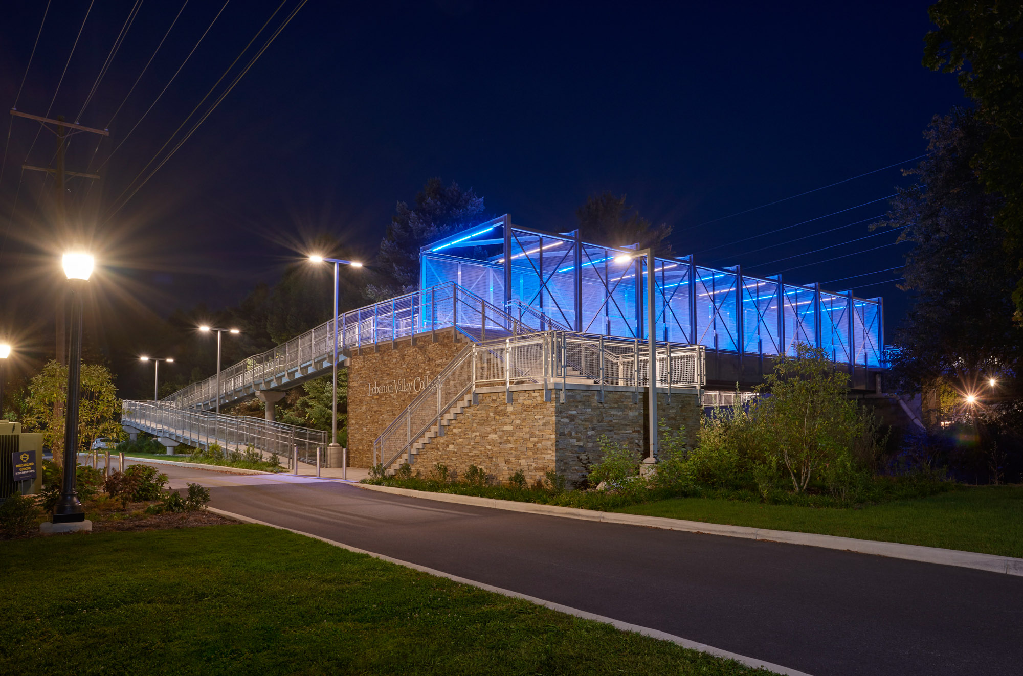 An evening view of the north entrance to the Lebanon Valley College pedestrian bridge