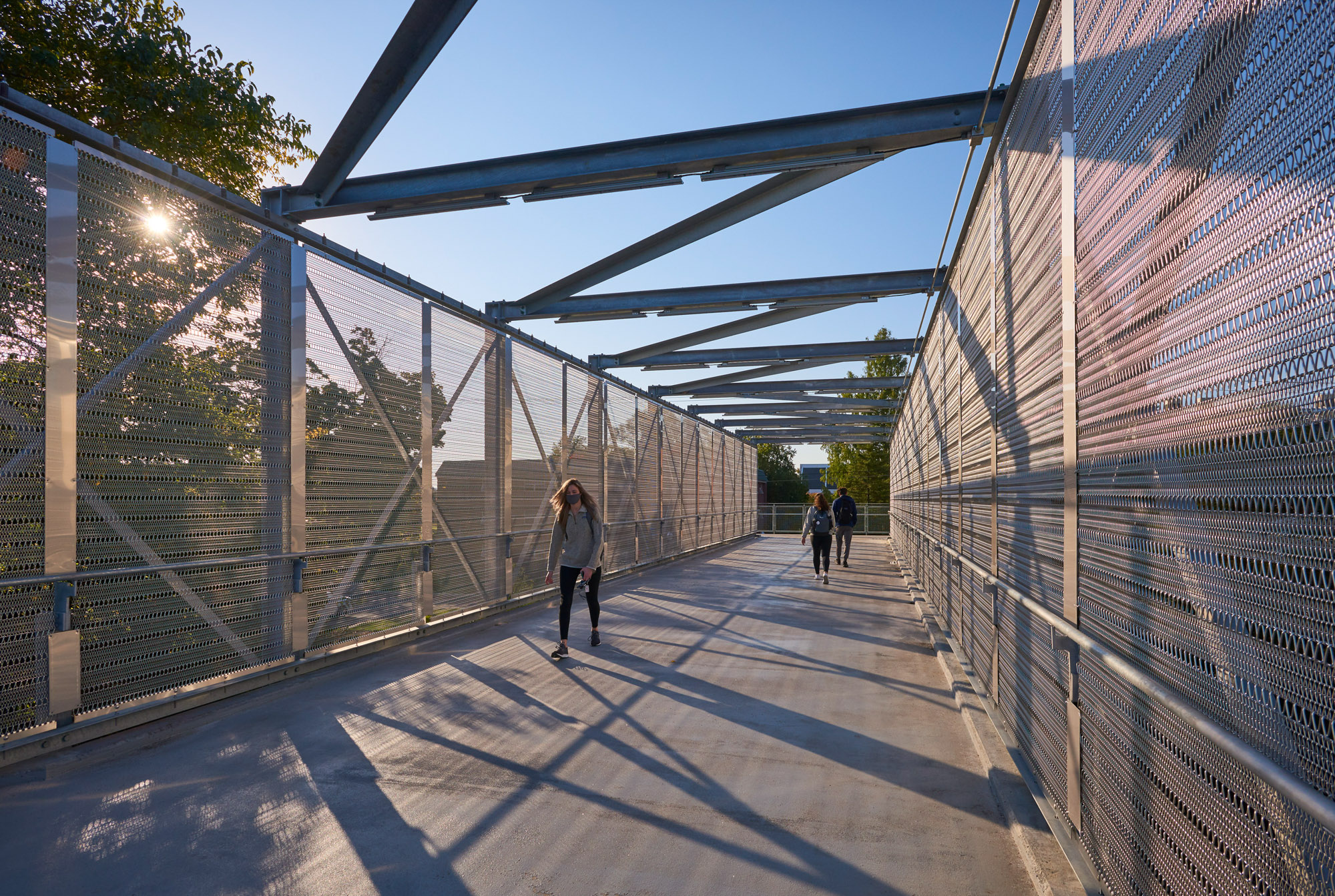 Students walk across the pedestrian bridge at Lebanon Valley College