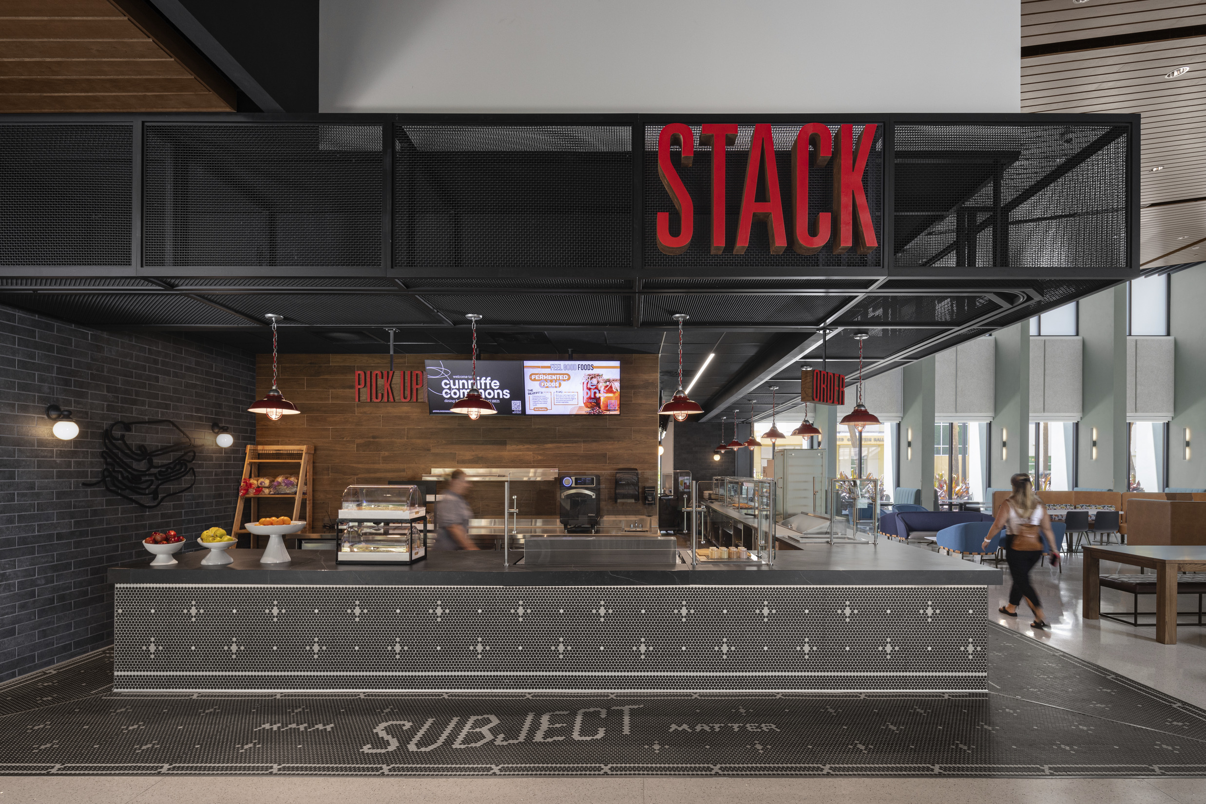 Stack sandwich platform showing signage, tile, and wood and metal finishes.