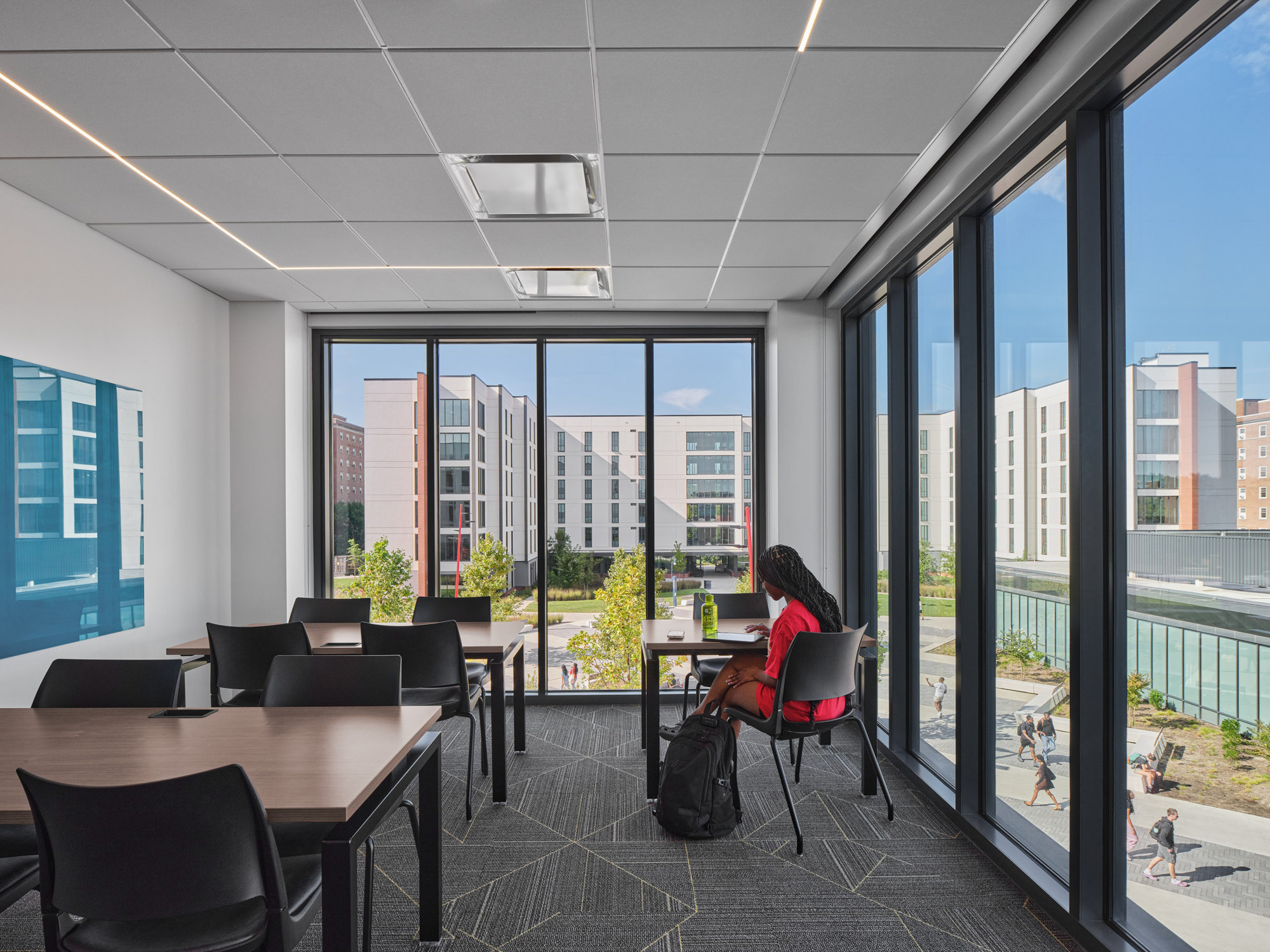 A corner lounge with floor-to-ceiling windows in University of Maryland's Heritage Community