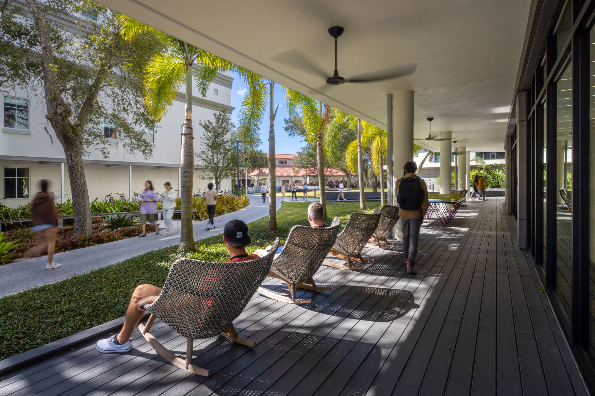 Students recline in porch chairs at Ringling College of Art and Design