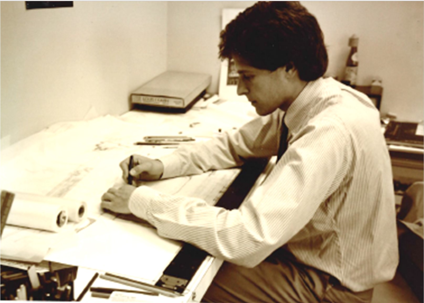 Adam working at his desk in 1984